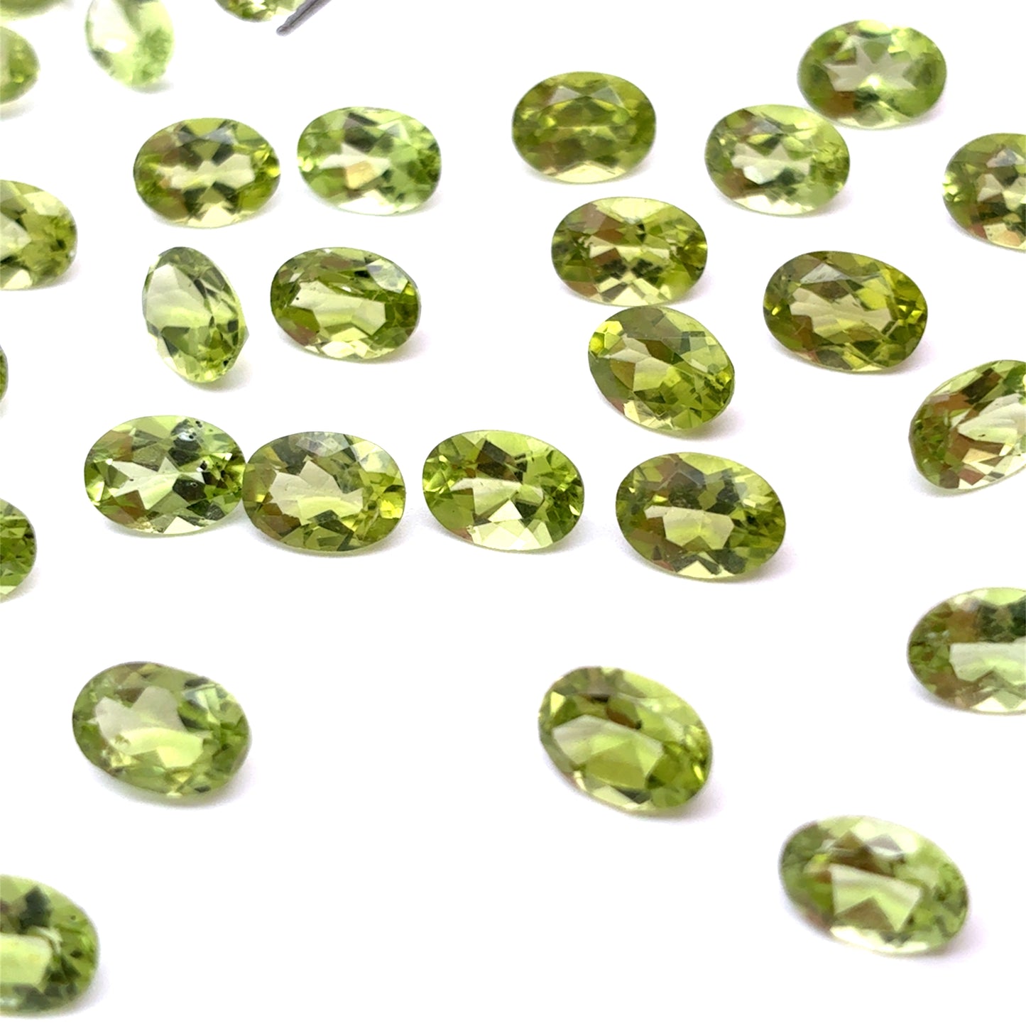 One 7x5mm Green Peridot Oval Cut, Faceted Loose Gemstone