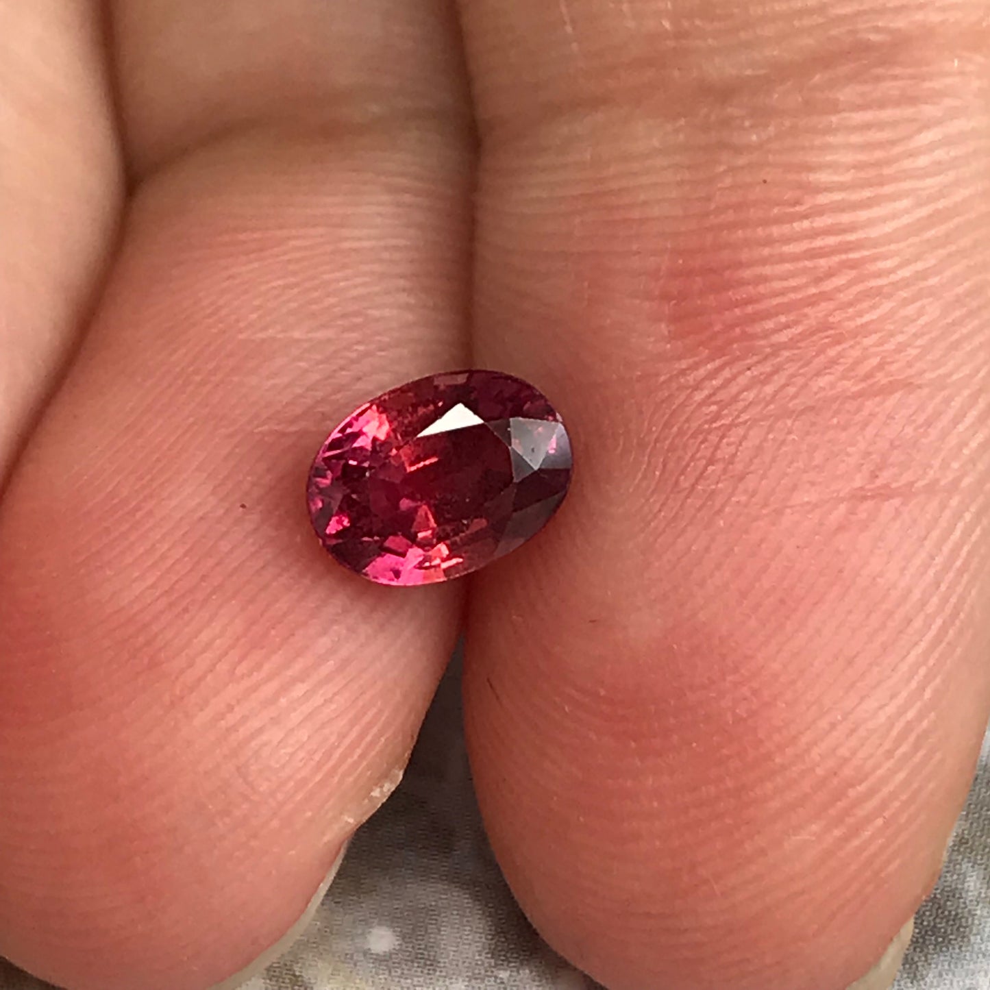 1.31 Carat Natural Red Sapphire 6.7x5mm Oval Cut, BE Treated Orangish Red Sapphire