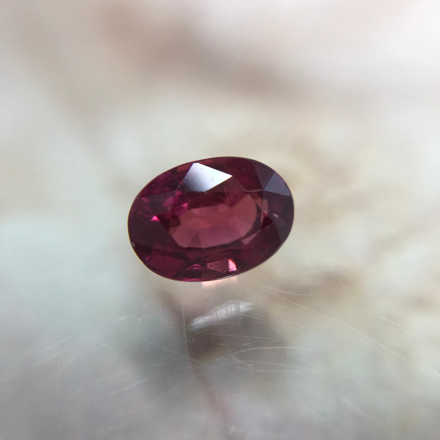 1.31 Carat Natural Red Sapphire 6.7x5mm Oval Cut, BE Treated Orangish Red Sapphire