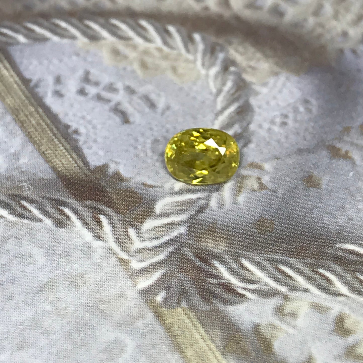 Yellow Sphene 1.23 Carat 6.8x5.2mm Oval Cut, Natural loose wholesale gemstone