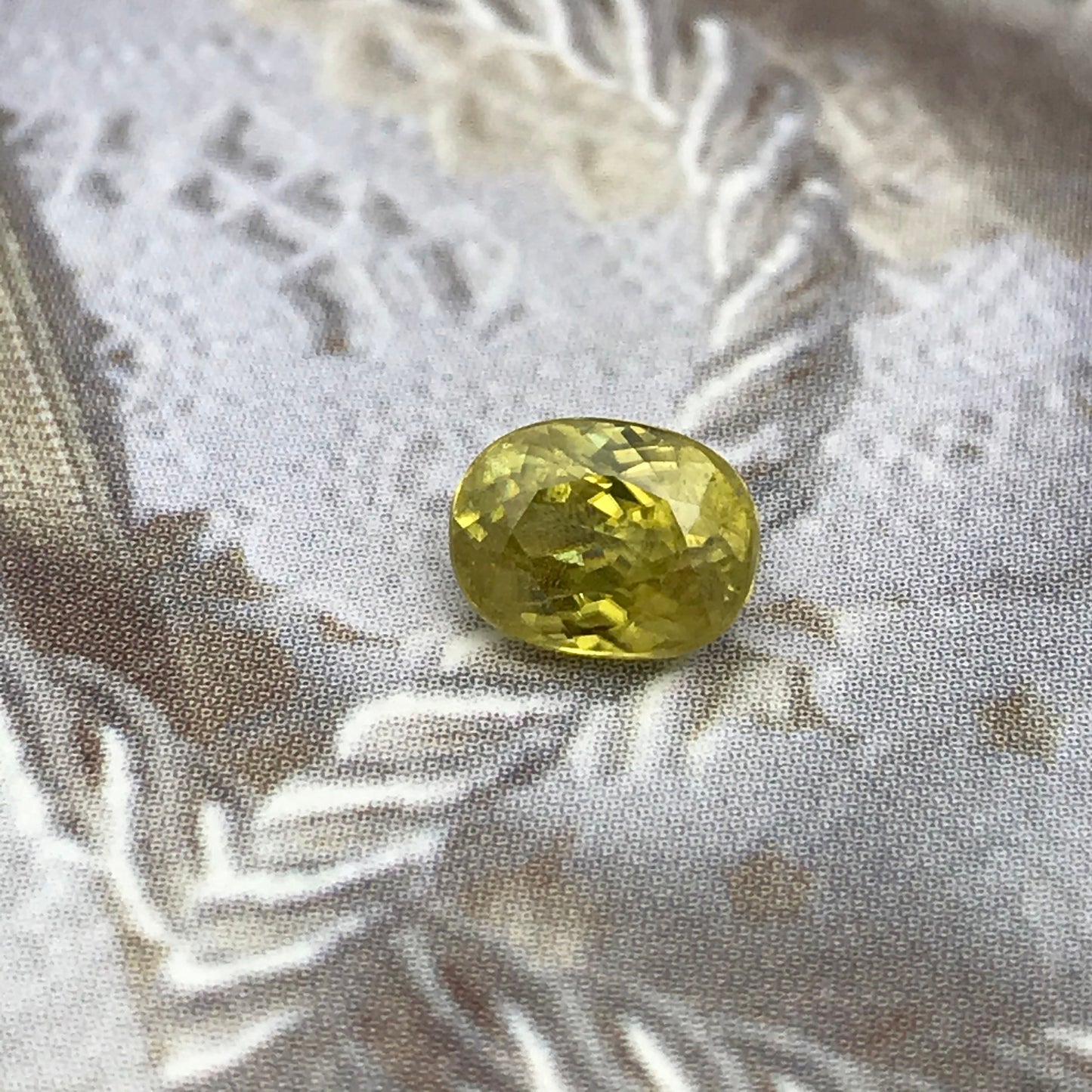 Yellow Sphene 1.23 Carat 6.8x5.2mm Oval Cut, Natural loose wholesale gemstone