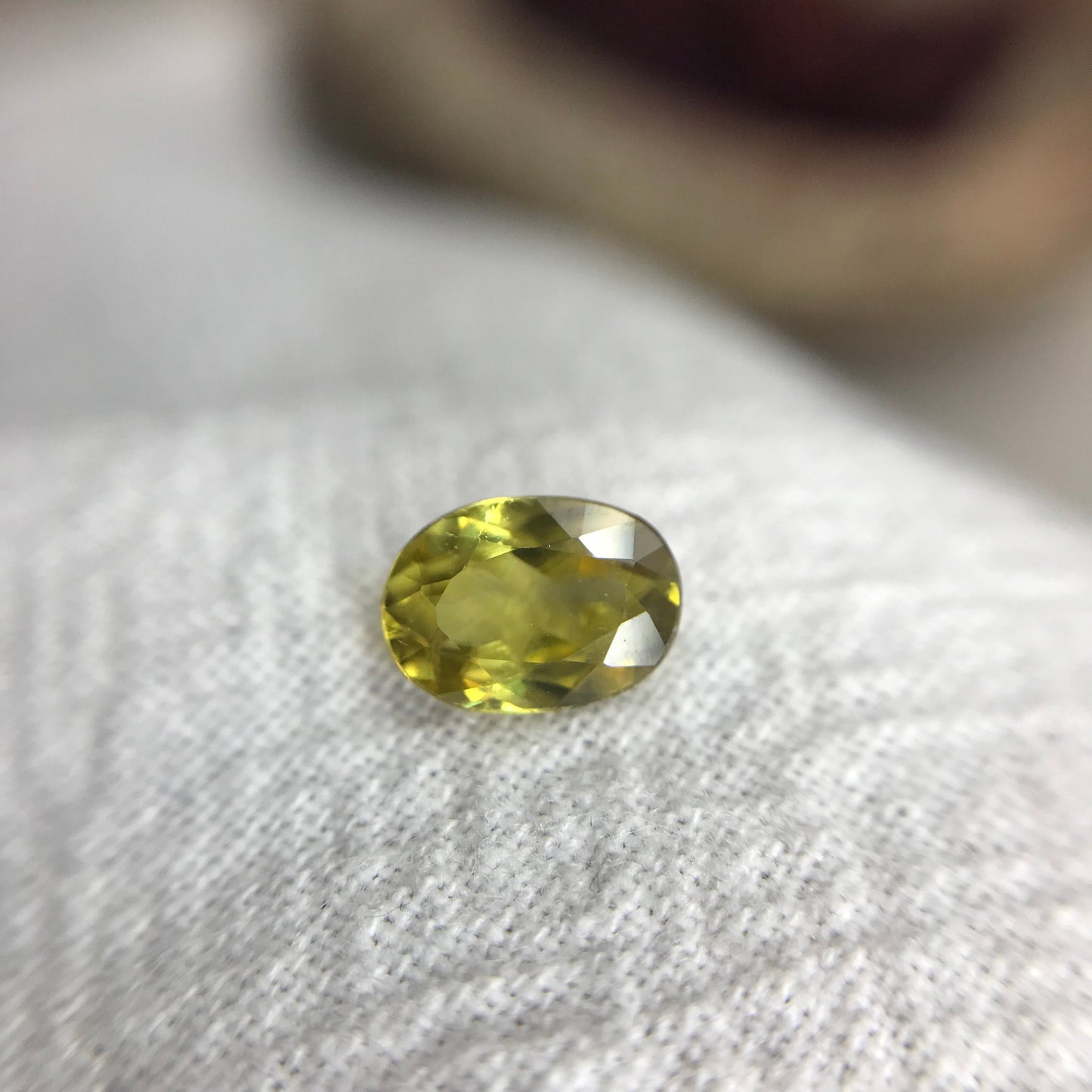 0.96 ct Yellow Sphene 7.5x5.5mm Oval Cut, Natural Untreated from Madagascar, 1 carat Greenish Yellow Sphene with Rainbow Flashes