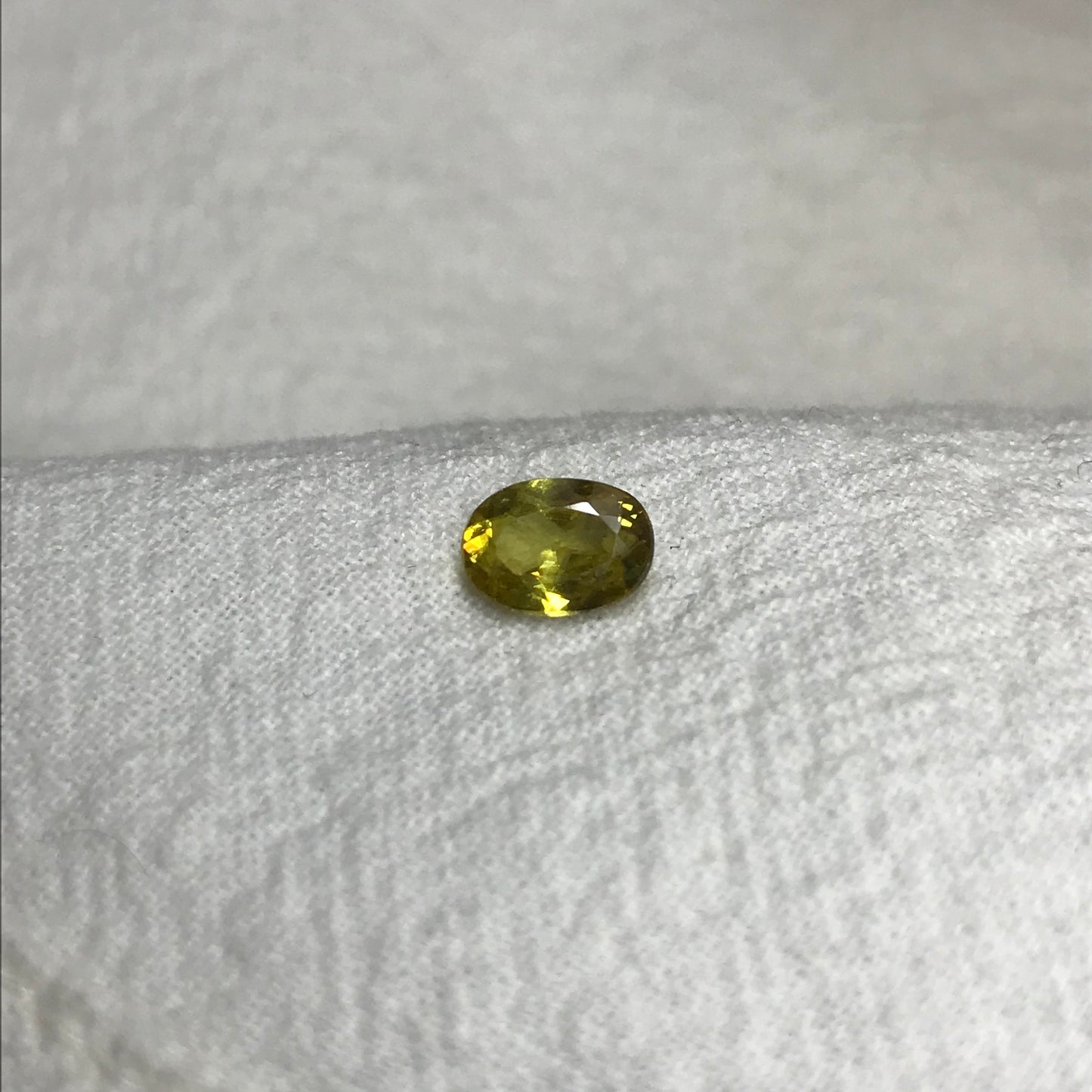 0.96 ct Yellow Sphene 7.5x5.5mm Oval Cut, Natural Untreated from Madagascar, 1 carat Greenish Yellow Sphene with Rainbow Flashes