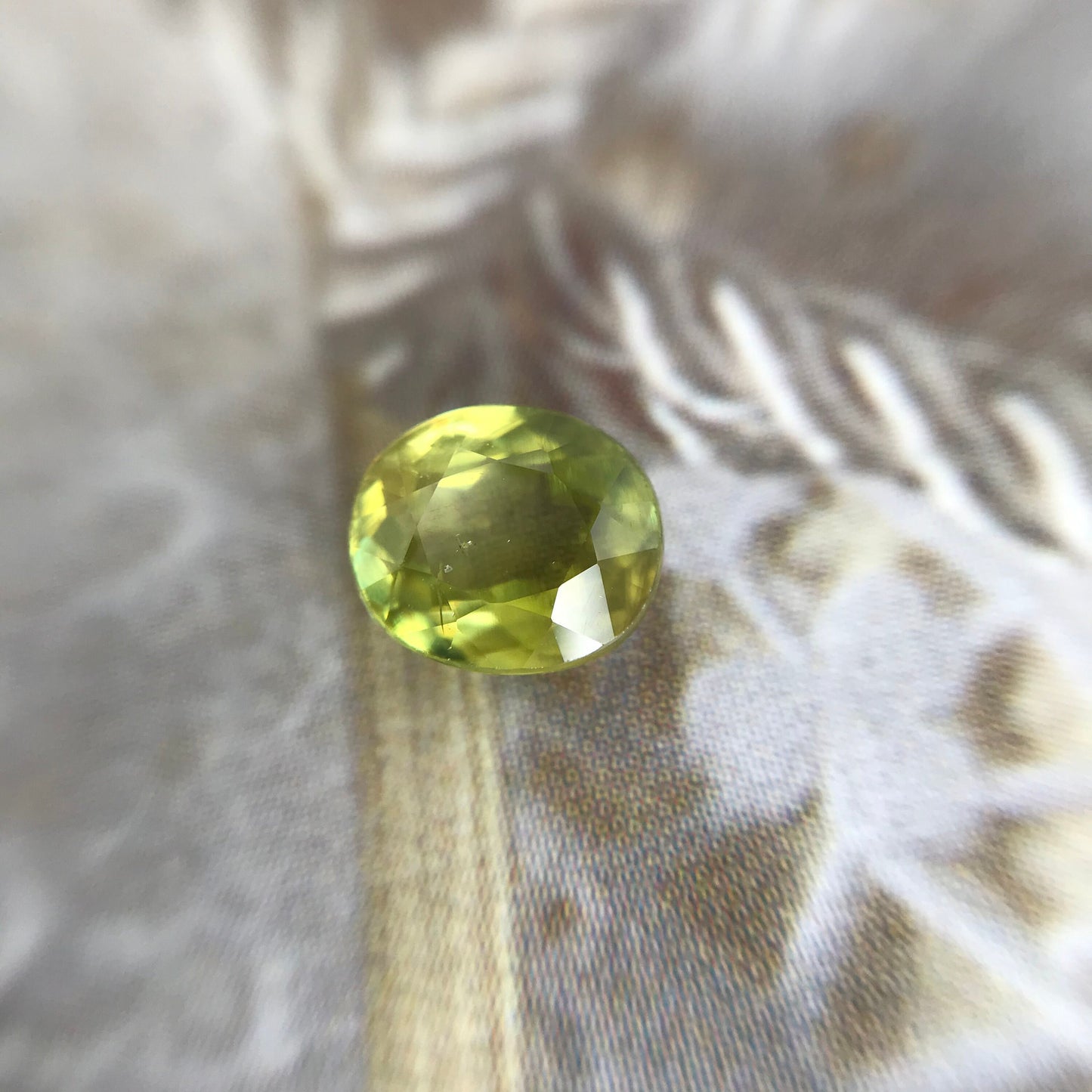 Yellowish Green Sphene 6.5x5.5mm Oval Cut 0.99 carat, Natural Madagascar Sphene, Faceted Loose Titanite