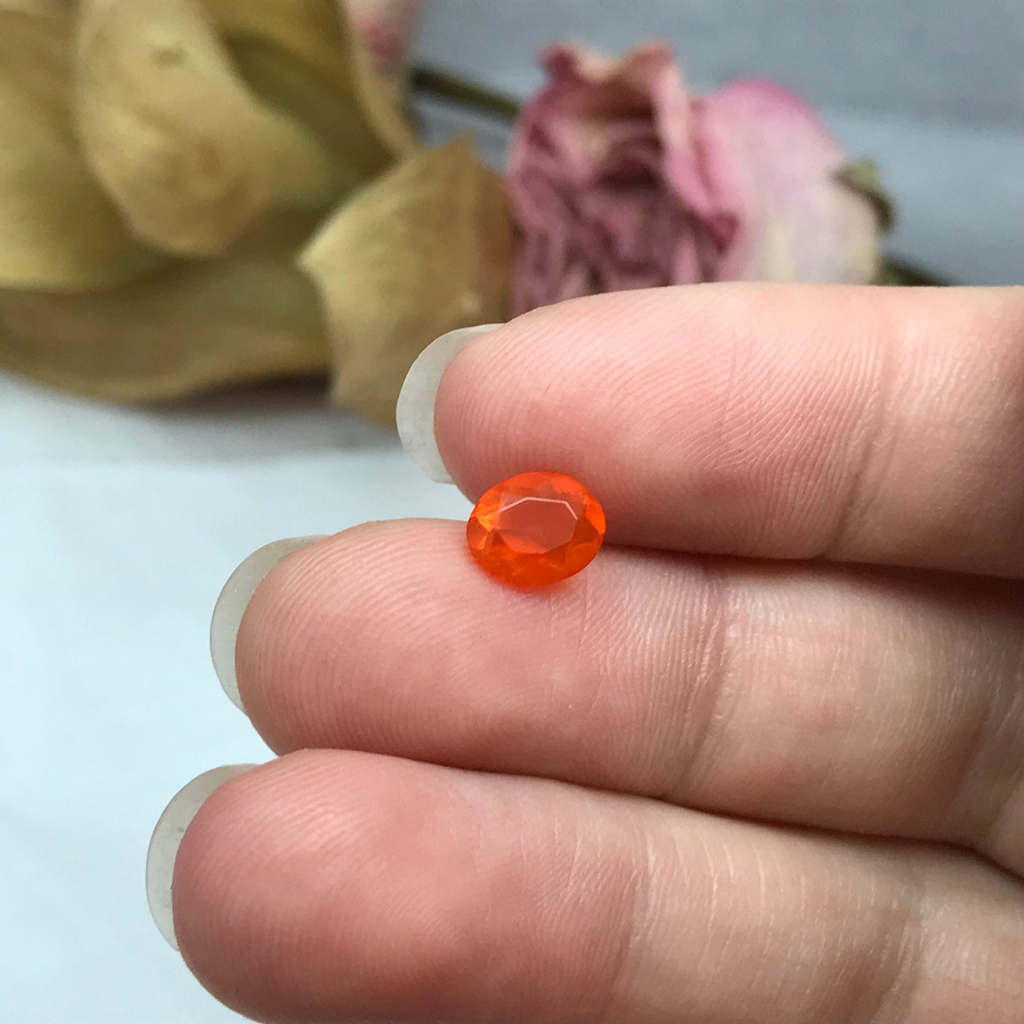 0.69 Carat Orange Mexican Fire Opal 7.4x6.0mm Oval Cut, Faceted Loose Opal