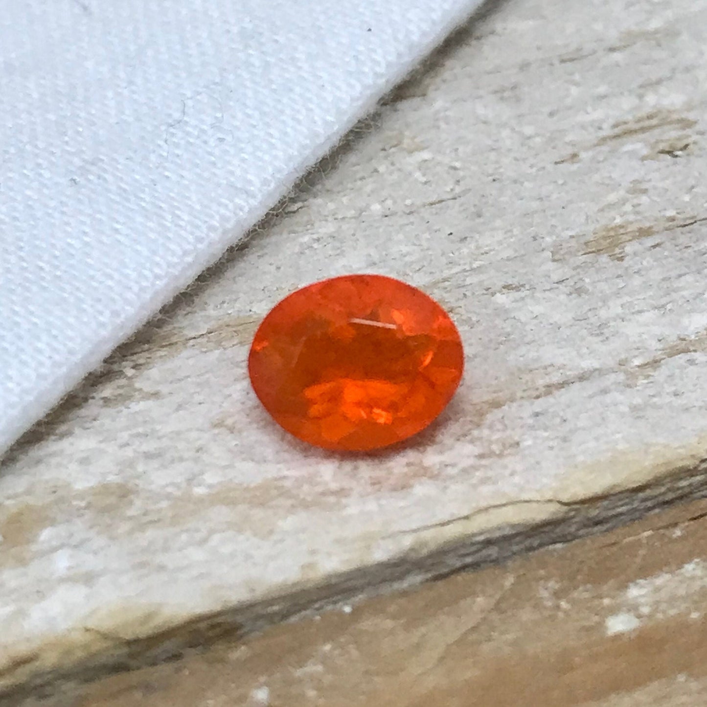 0.69 Carat Orange Mexican Fire Opal 7.4x6.0mm Oval Cut, Faceted Loose Opal