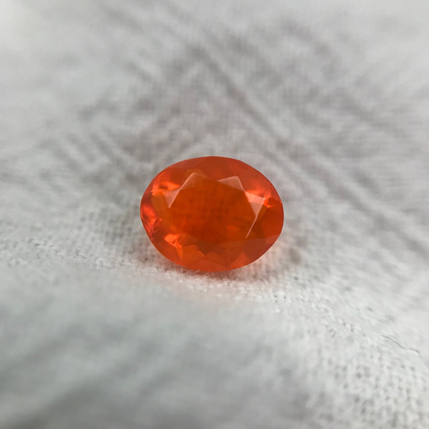 0.69 Carat Orange Mexican Fire Opal 7.4x6.0mm Oval Cut, Faceted Loose Opal