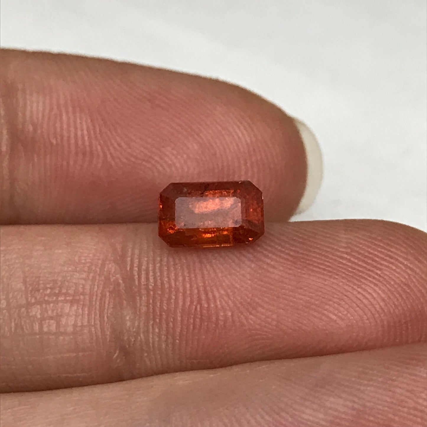 1.57 ct Natural Orange Sapphire 7.7x4.7mm Emerald Cut Loose Faceted Gem, Reddish Orange Beryllium Treated Sapphire