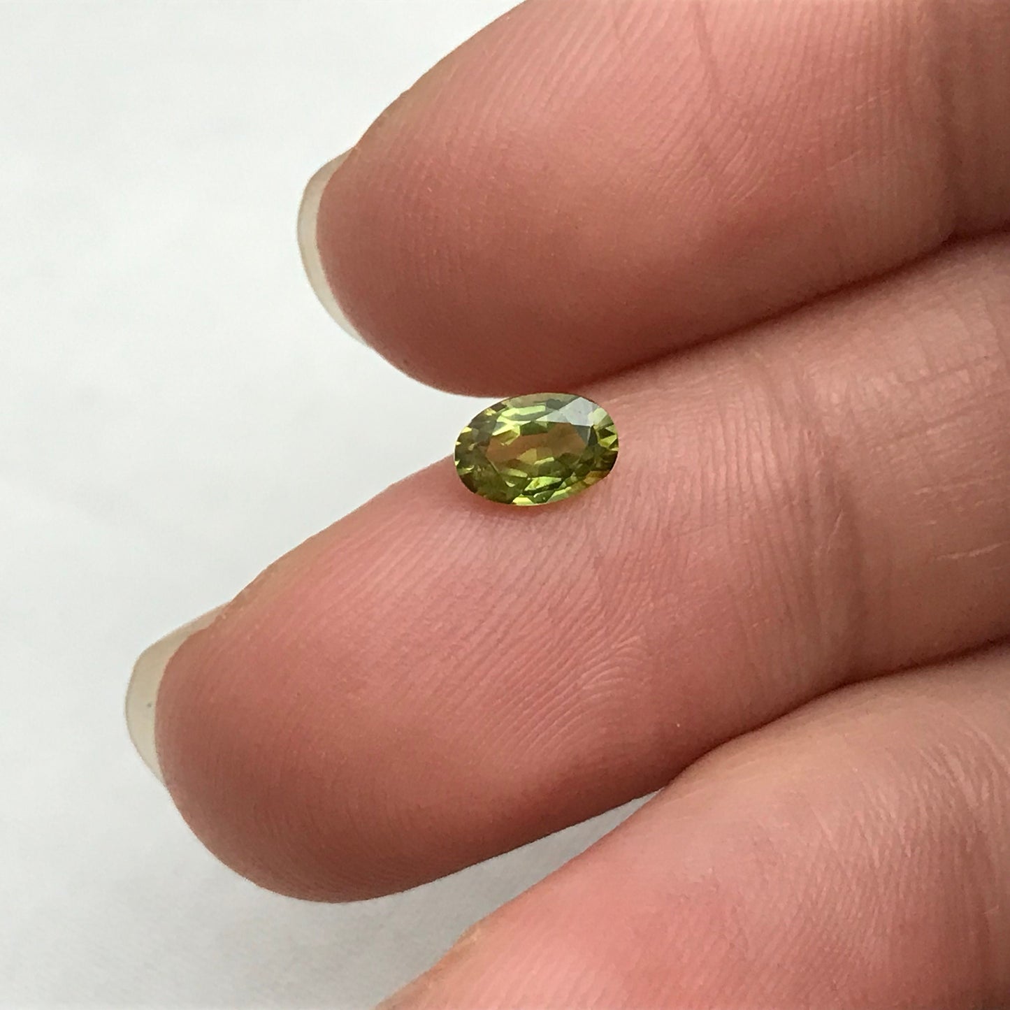 Greenish Yellow Sapphire 6x4mm, Color-Treated Yellow Green 0.53 Ct, Oval cut, BE Treated Natural Sapphire