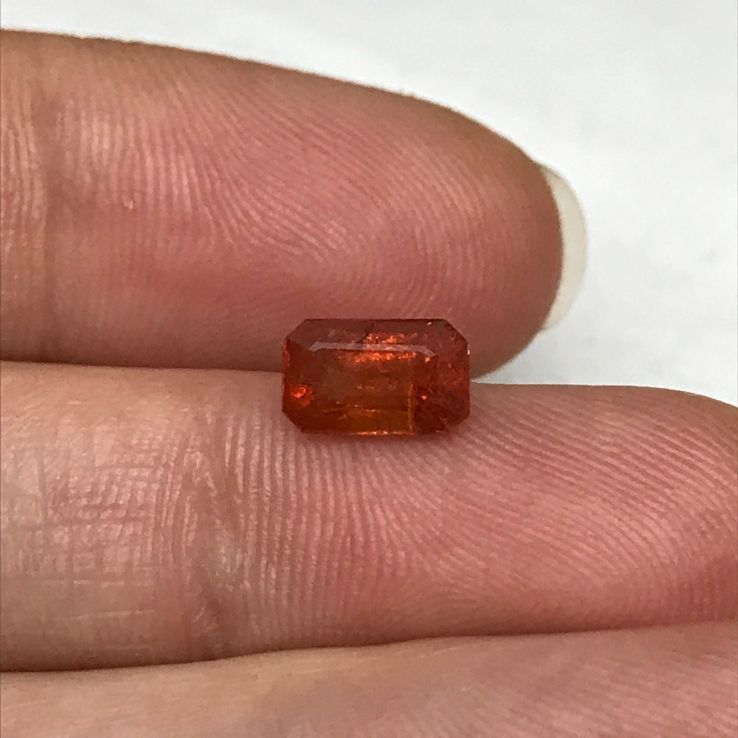 1.57 ct Natural Orange Sapphire 7.7x4.7mm Emerald Cut Loose Faceted Gem, Reddish Orange Beryllium Treated Sapphire