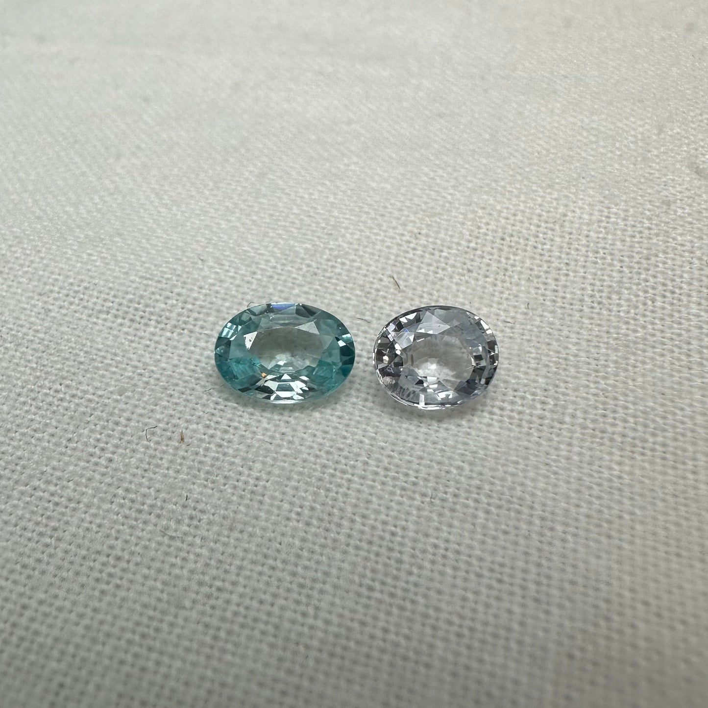 Natural Light Sapphire and Blue Zircon Parcel, 6.8x5mm Oval cut Zircon and 5.8x5mm Sapphire