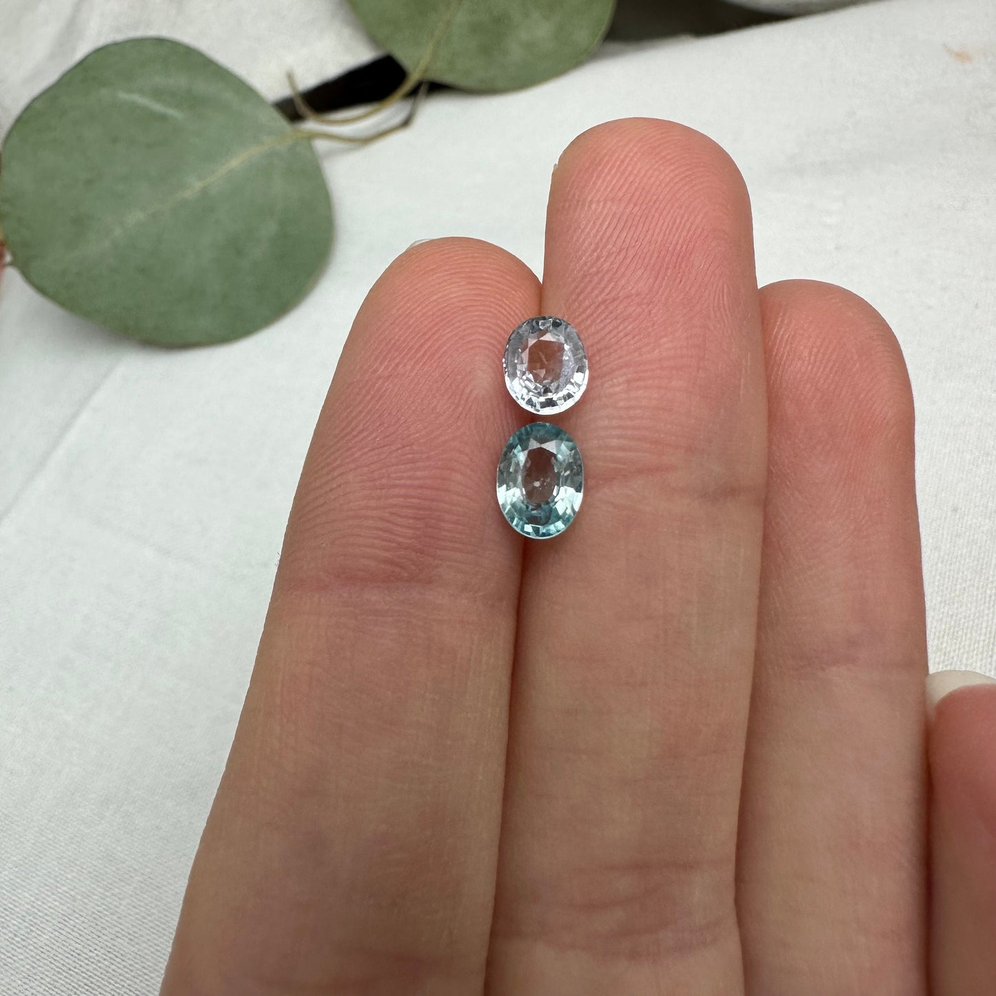Natural Light Sapphire and Blue Zircon Parcel, 6.8x5mm Oval cut Zircon and 5.8x5mm Sapphire