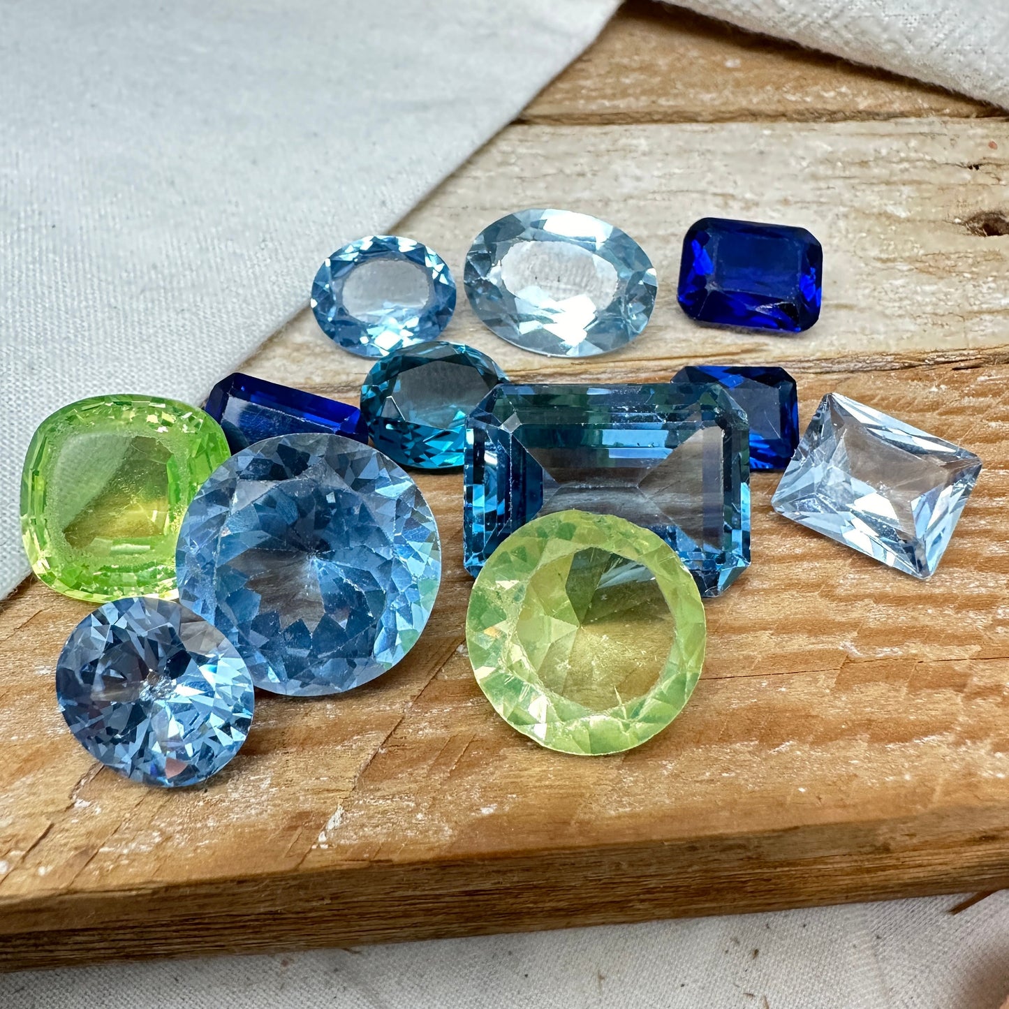 116 carat Lot of Lab Created Spinel 12 stones, Discounted Worn, Faceted, Recycled, Chipped, Damaged Gemstones, Blue and Yellow Green