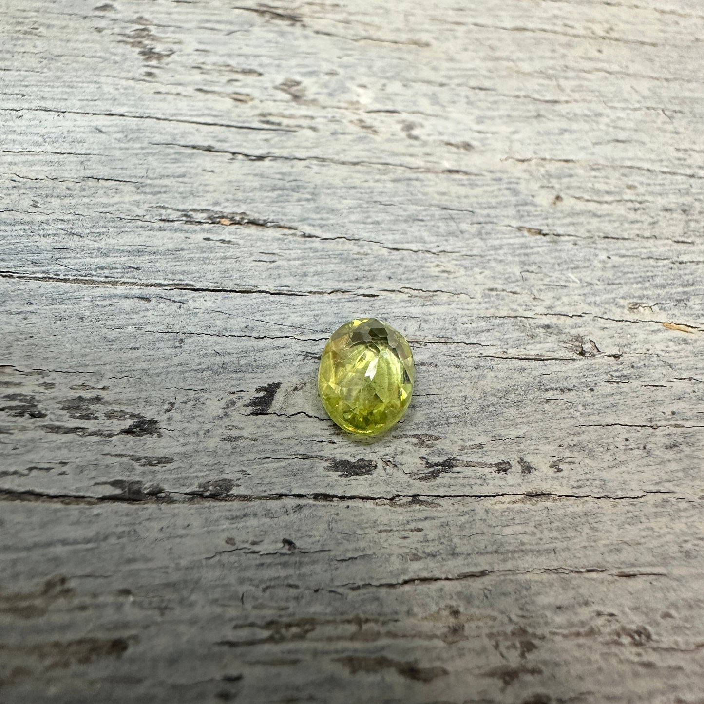 0.93 Yellow Green Sphene with Rainbow Flashes 7.3x5.3mm Oval Cut, Faceted Loose Titanite