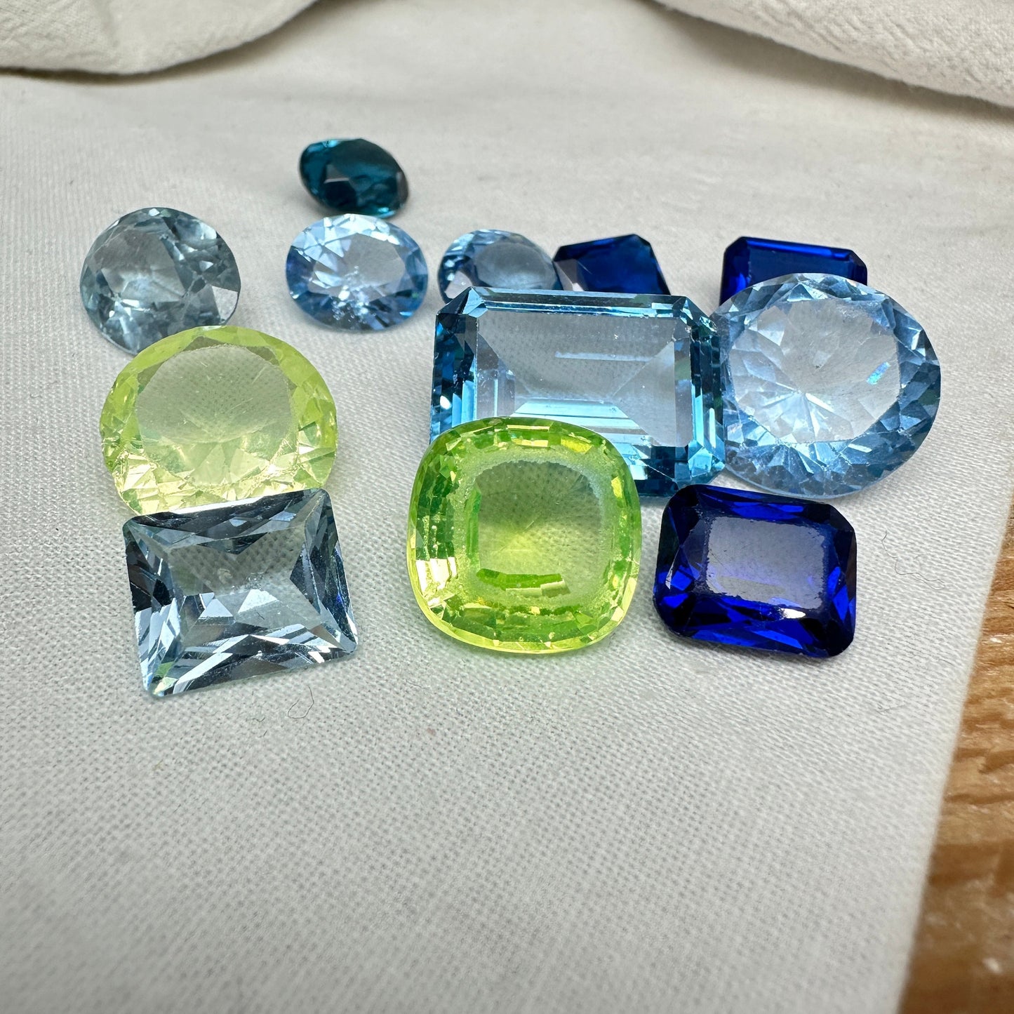 116 carat Lot of Lab Created Spinel 12 stones, Discounted Worn, Faceted, Recycled, Chipped, Damaged Gemstones, Blue and Yellow Green