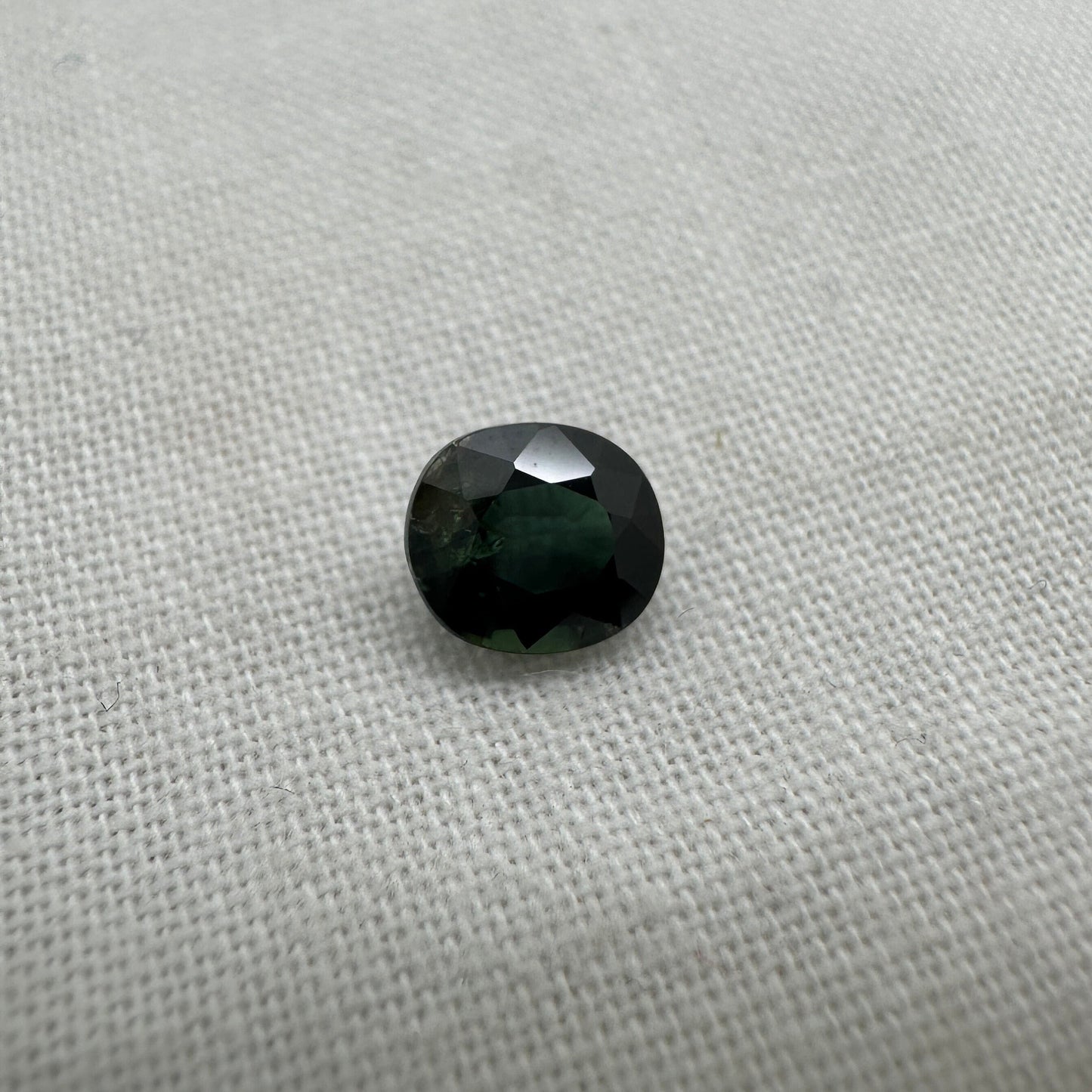 1.26 Carat Natural Blue Green  Sapphire 6.5x5.7mm Oval Cut, Dark Bluish Green Faceted Loose Heated Corundum