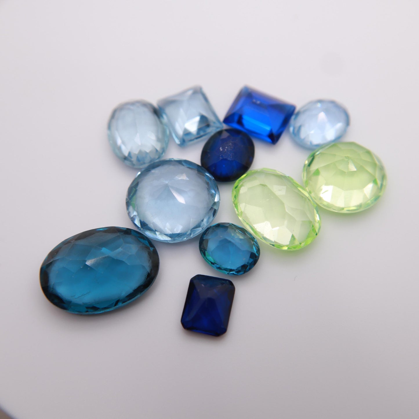 106 carat Lot of Lab Created Spinel 11 stones, Discounted Worn, Faceted, Recycled, Chipped, Damaged Gemstones, Blue and Yellow-Green