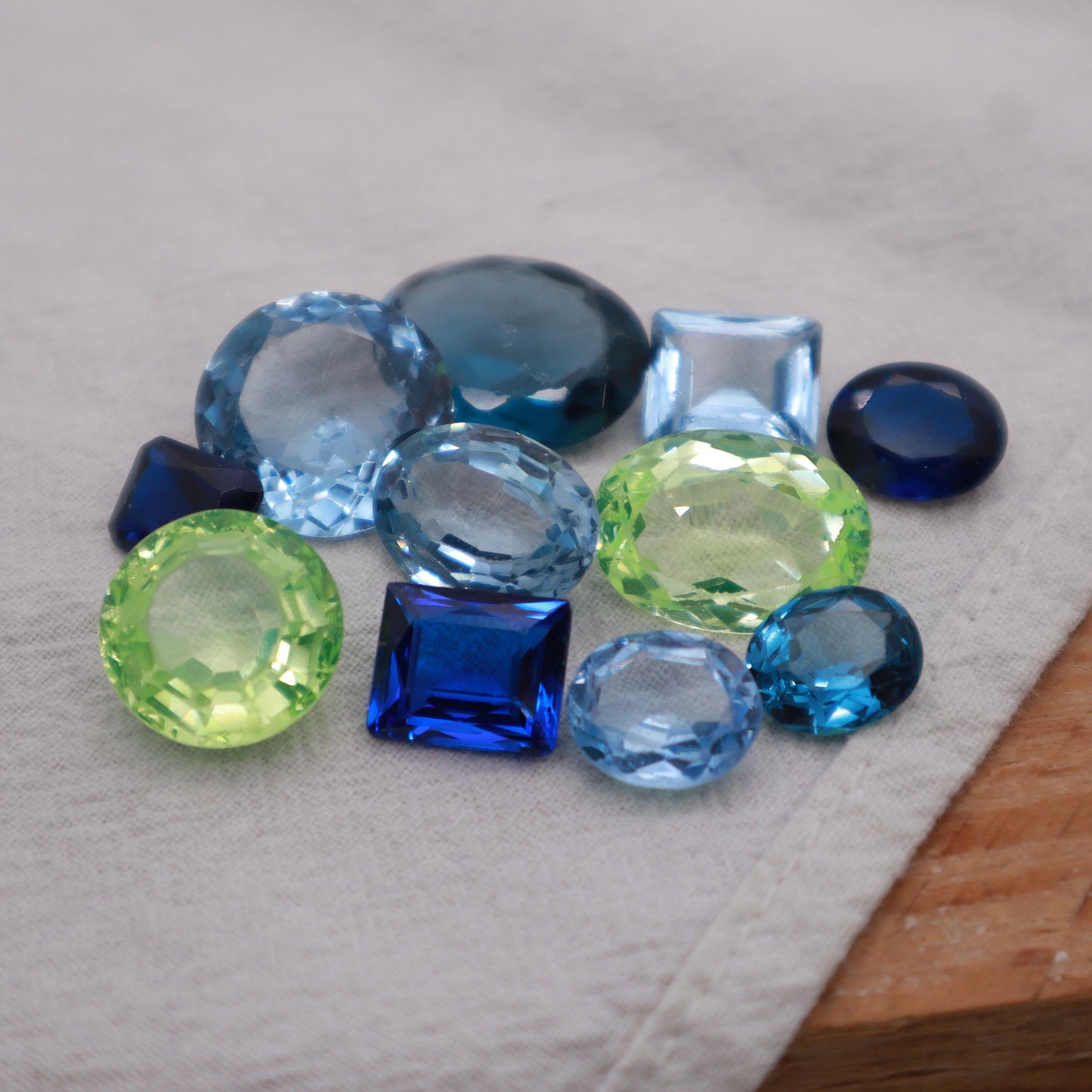 106 carat Lot of Lab Created Spinel 11 stones, Discounted Worn, Faceted, Recycled, Chipped, Damaged Gemstones, Blue and Yellow-Green