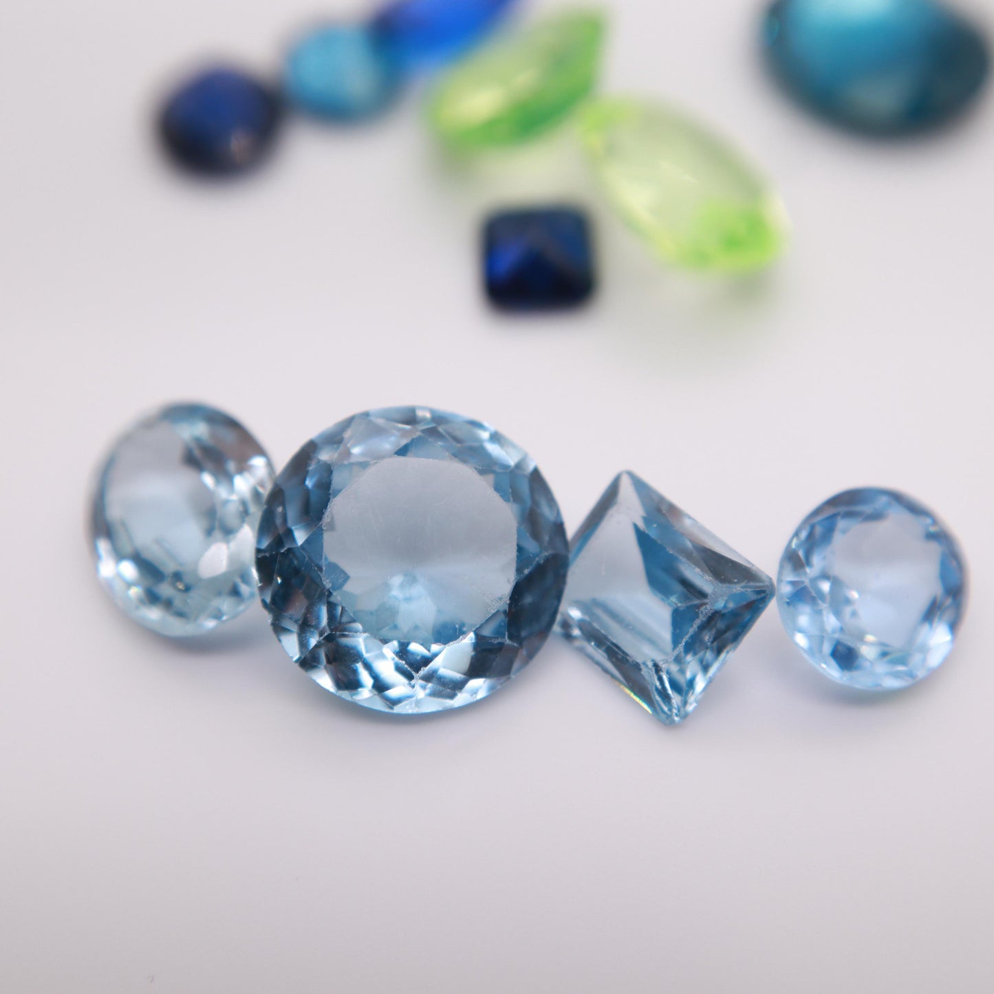 106 carat Lot of Lab Created Spinel 11 stones, Discounted Worn, Faceted, Recycled, Chipped, Damaged Gemstones, Blue and Yellow-Green