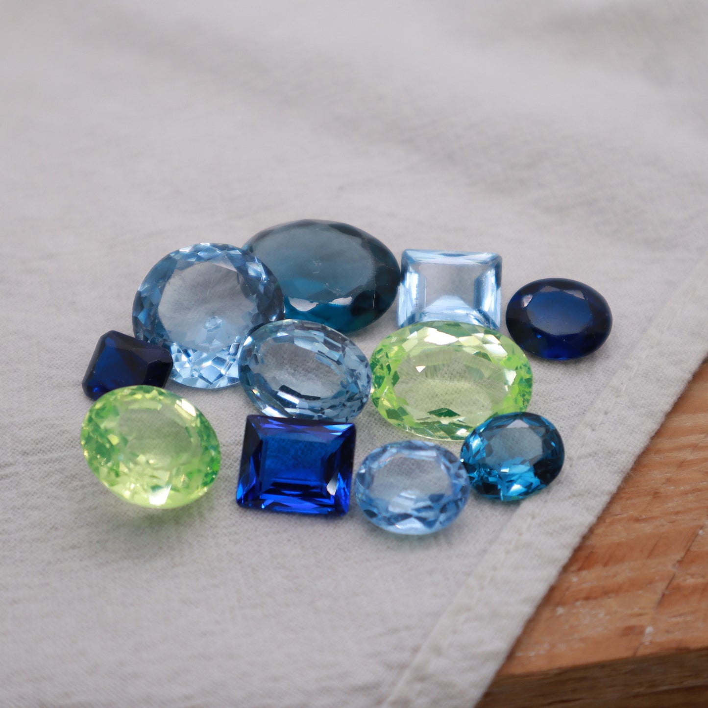 106 carat Lot of Lab Created Spinel 11 stones, Discounted Worn, Faceted, Recycled, Chipped, Damaged Gemstones, Blue and Yellow-Green