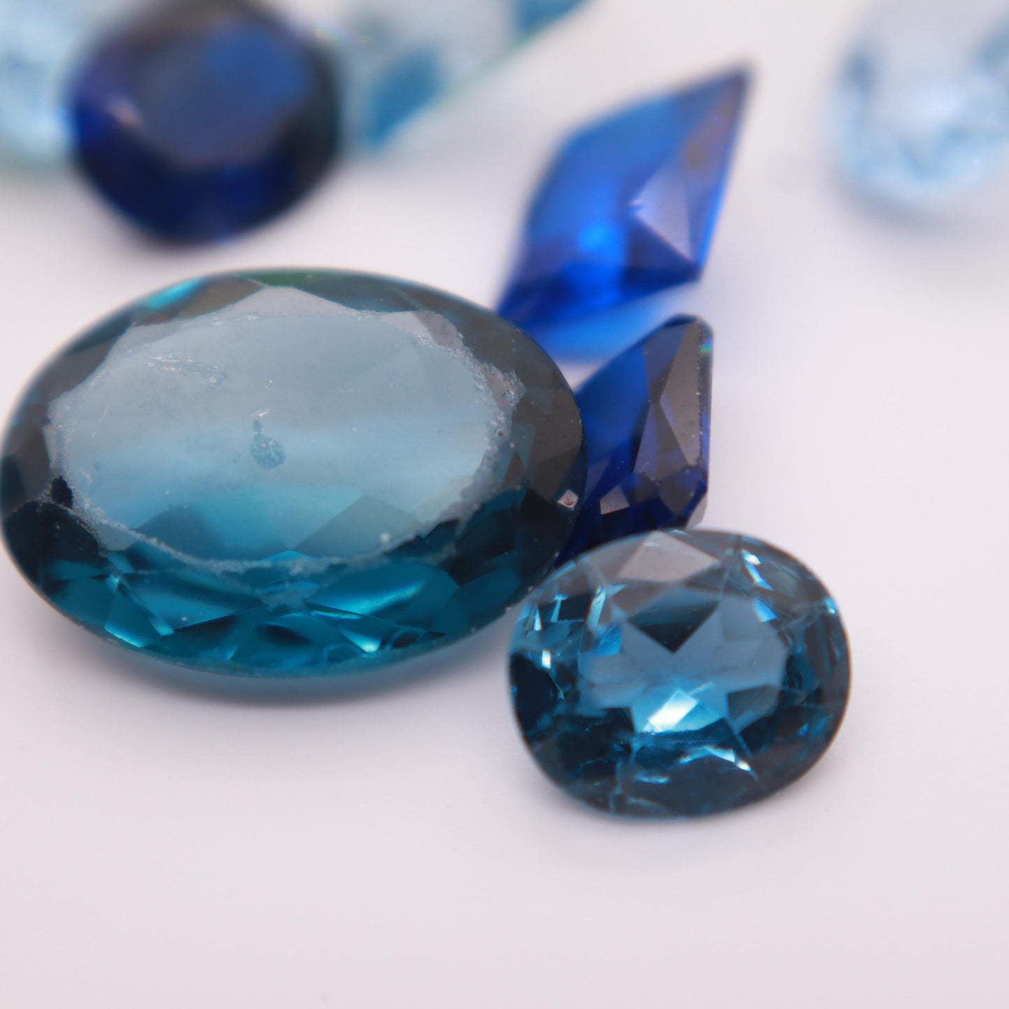 106 carat Lot of Lab Created Spinel 11 stones, Discounted Worn, Faceted, Recycled, Chipped, Damaged Gemstones, Blue and Yellow-Green