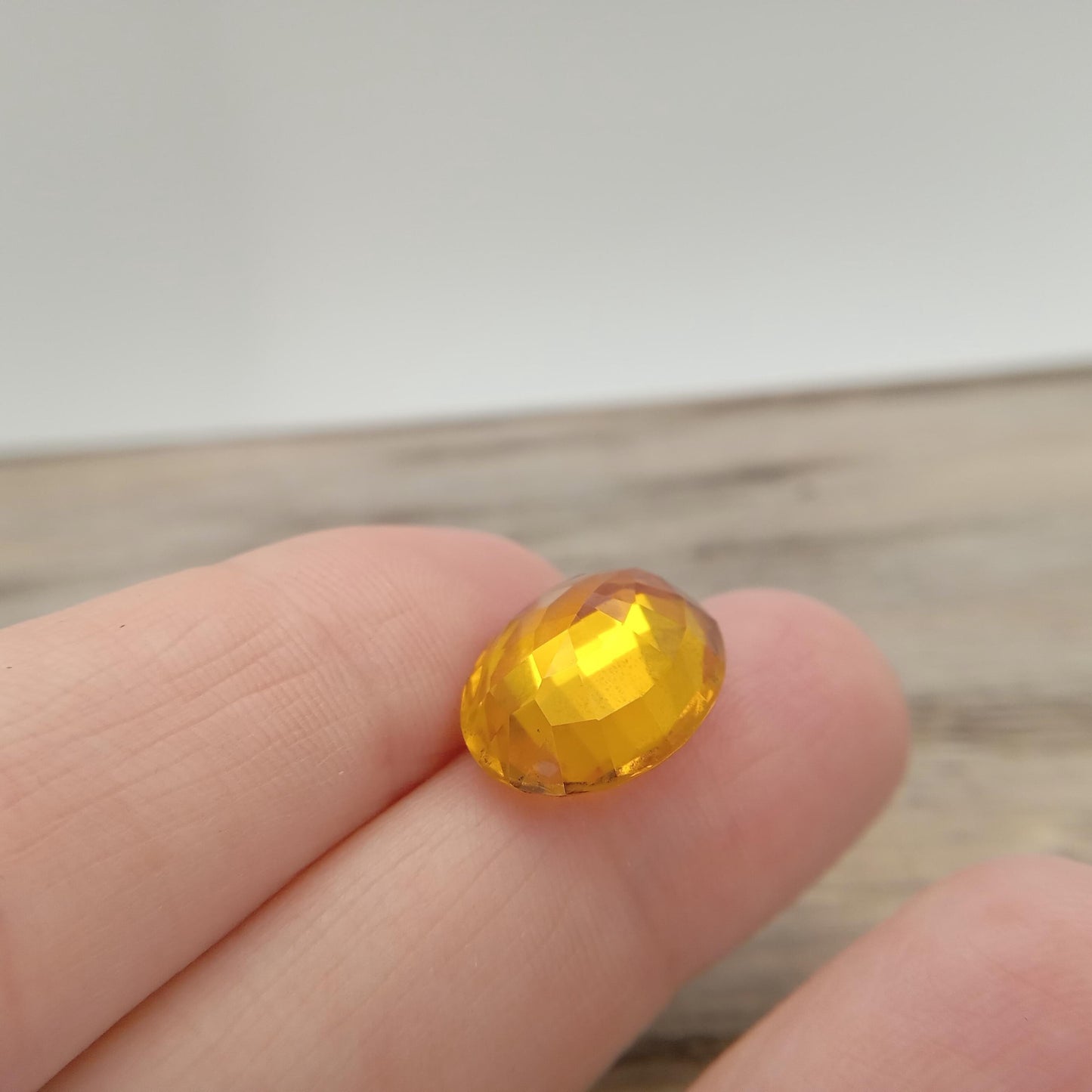 15.9mm x 12.2mm Oval Orange Yellow Synthetic Sapphire, 11.49 carat, Faceted Loose Gemstone
