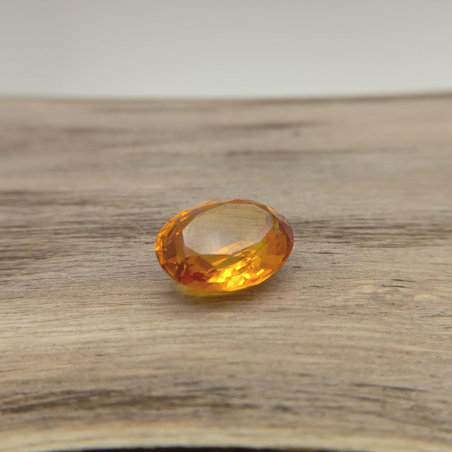 15.9mm x 12.2mm Oval Orange Yellow Synthetic Sapphire, 11.49 carat, Faceted Loose Gemstone