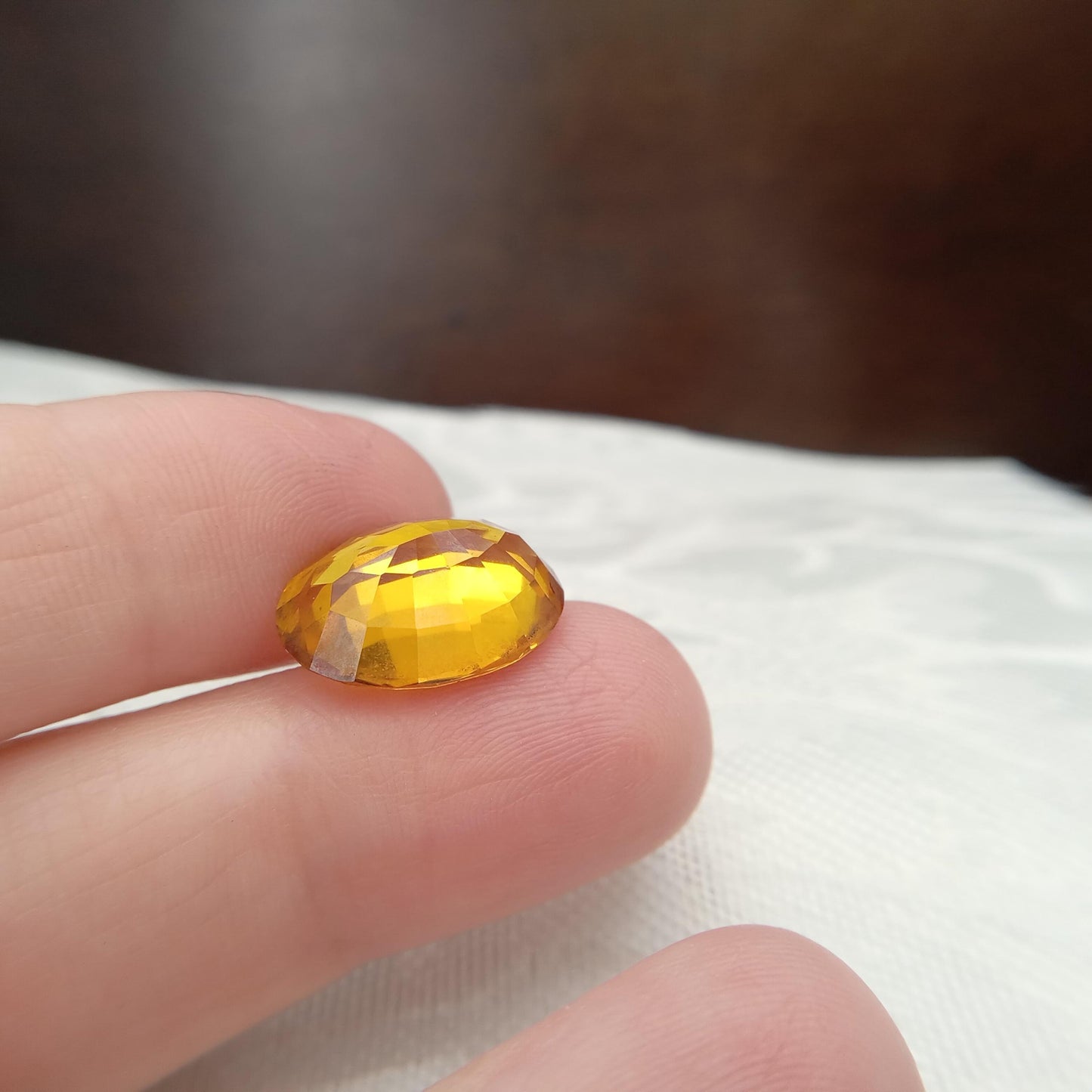 15.9mm x 12.2mm Oval Orange Yellow Synthetic Sapphire, 11.49 carat, Faceted Loose Gemstone