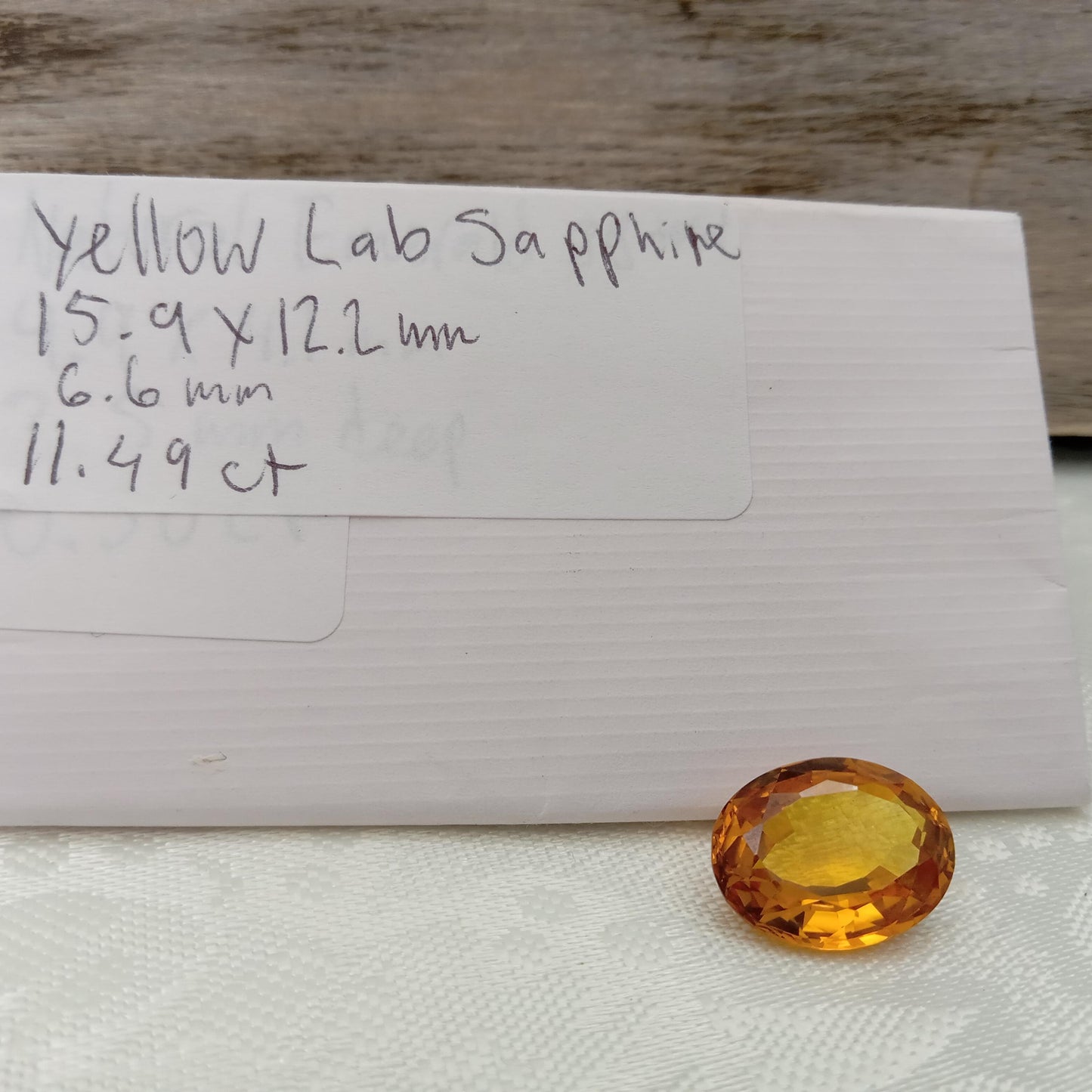 15.9mm x 12.2mm Oval Orange Yellow Synthetic Sapphire, 11.49 carat, Faceted Loose Gemstone