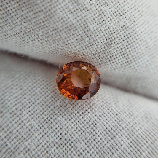 0.62 carat 5x4.3mm Natural Mandarin Spessartite Garnet, Faceted Oval Gemstone, Orange Garnet
