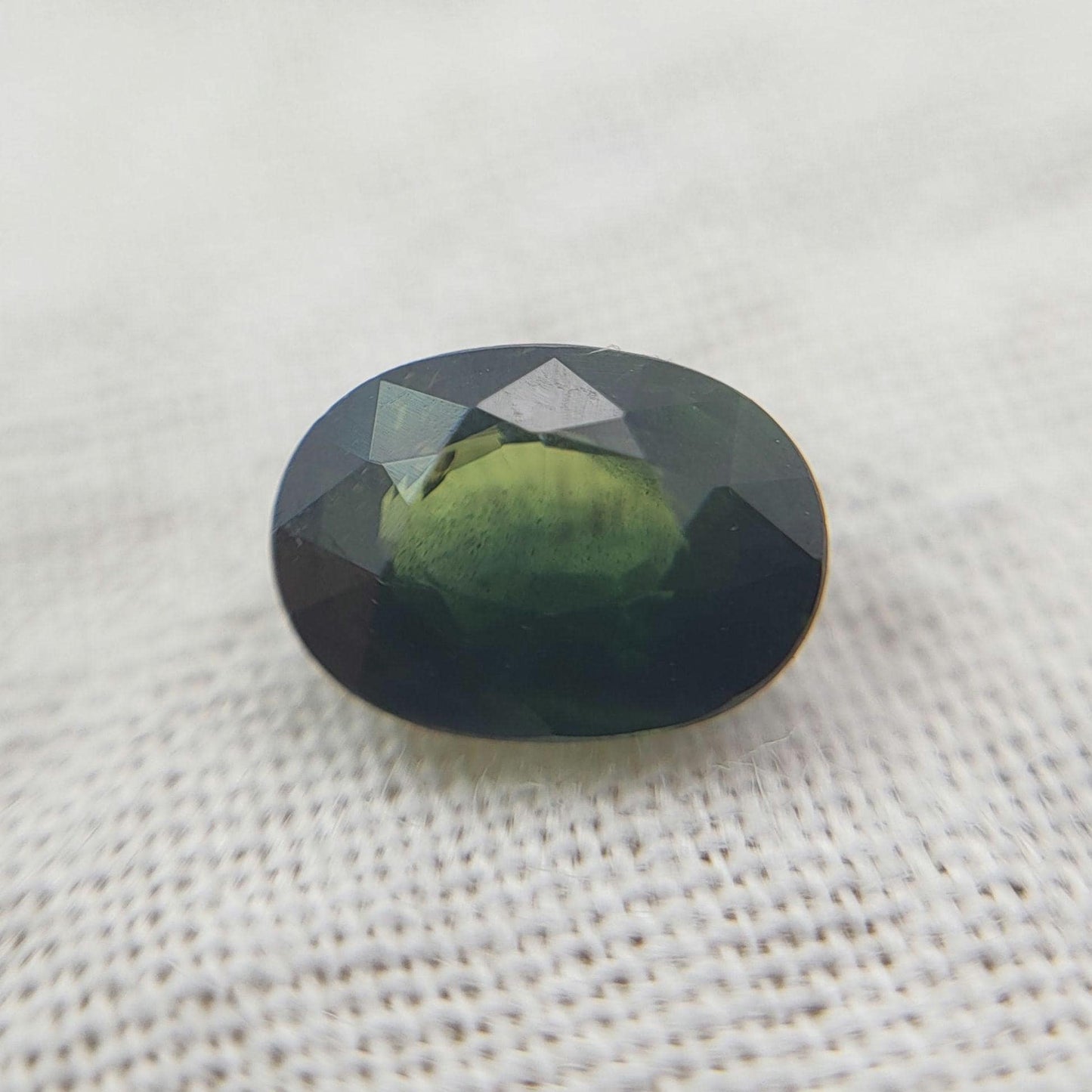0.72 Carat Dark Green Sapphire 6.3x4.5mm Oval Cut, Faceted Loose Natural Heated Sapphire