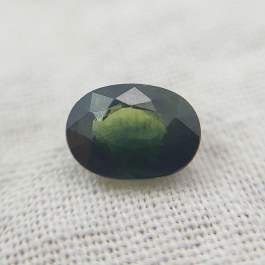 0.72 Carat Dark Green Sapphire 6.3x4.5mm Oval Cut, Faceted Loose Natural Heated Sapphire