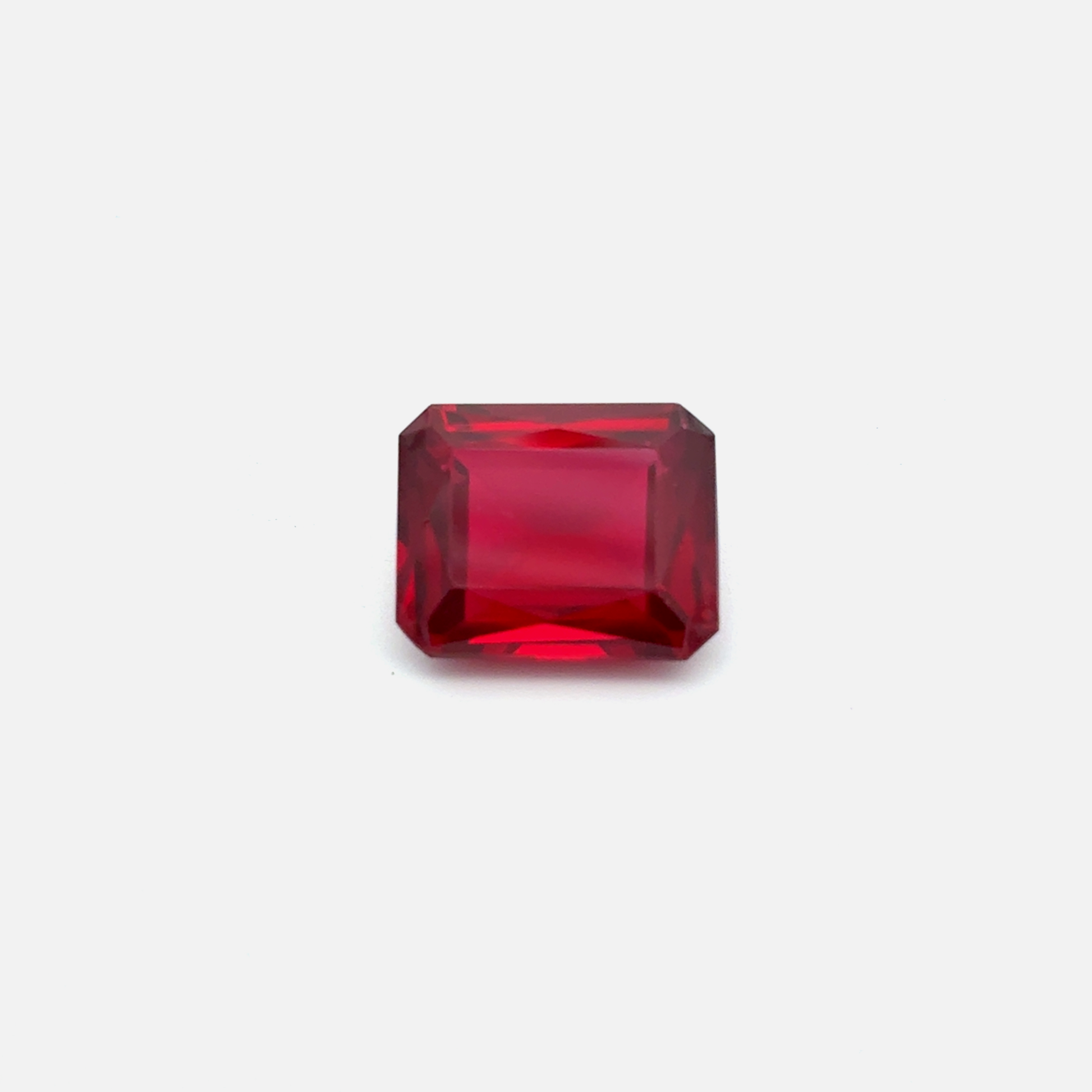 Rectangular red lab ruby on a white background