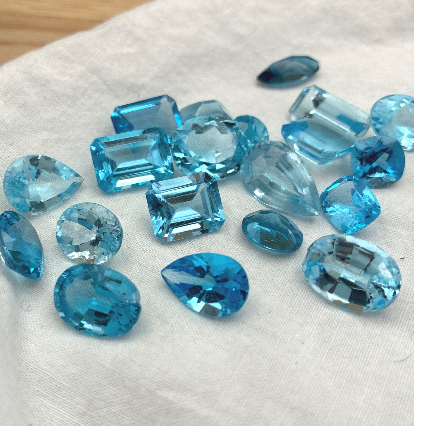 128 carat Lot of Damaged Blue Topaz-21 Piece Pre-formed Topaz Facet Rough