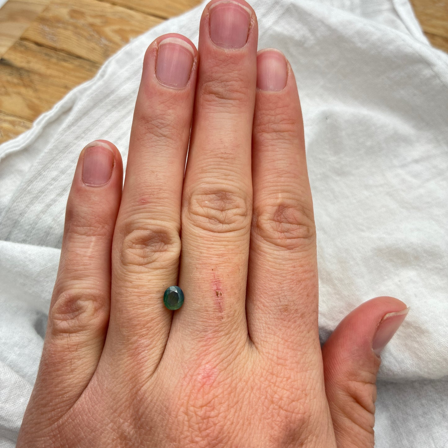 Natural Bluish Green Mermaid Sapphire 0.77 carat 5.5x4.8mm Oval Cut, Heated