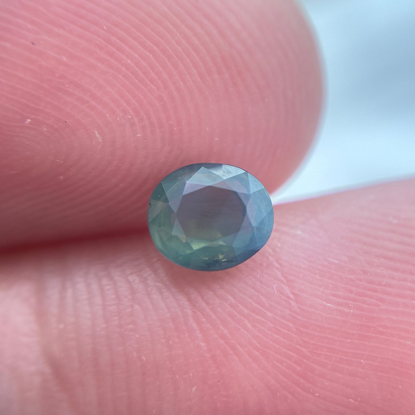 Natural Bluish Green Mermaid Sapphire 0.77 carat 5.5x4.8mm Oval Cut, Heated