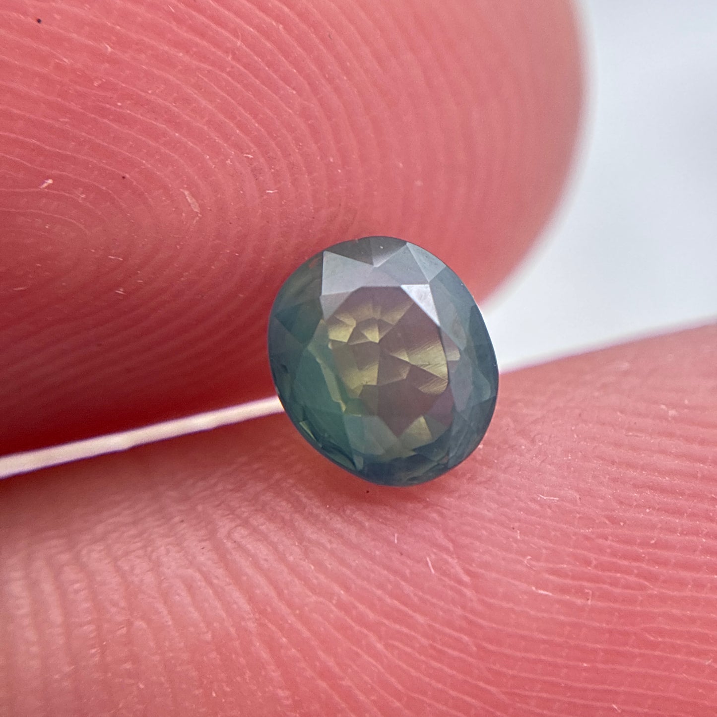 Natural Bluish Green Mermaid Sapphire 0.77 carat 5.5x4.8mm Oval Cut, Heated