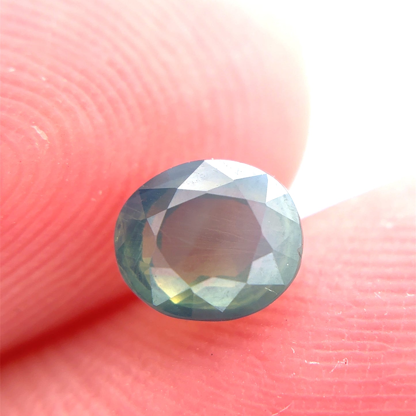 Natural Bluish Green Mermaid Sapphire 0.77 carat 5.5x4.8mm Oval Cut, Heated