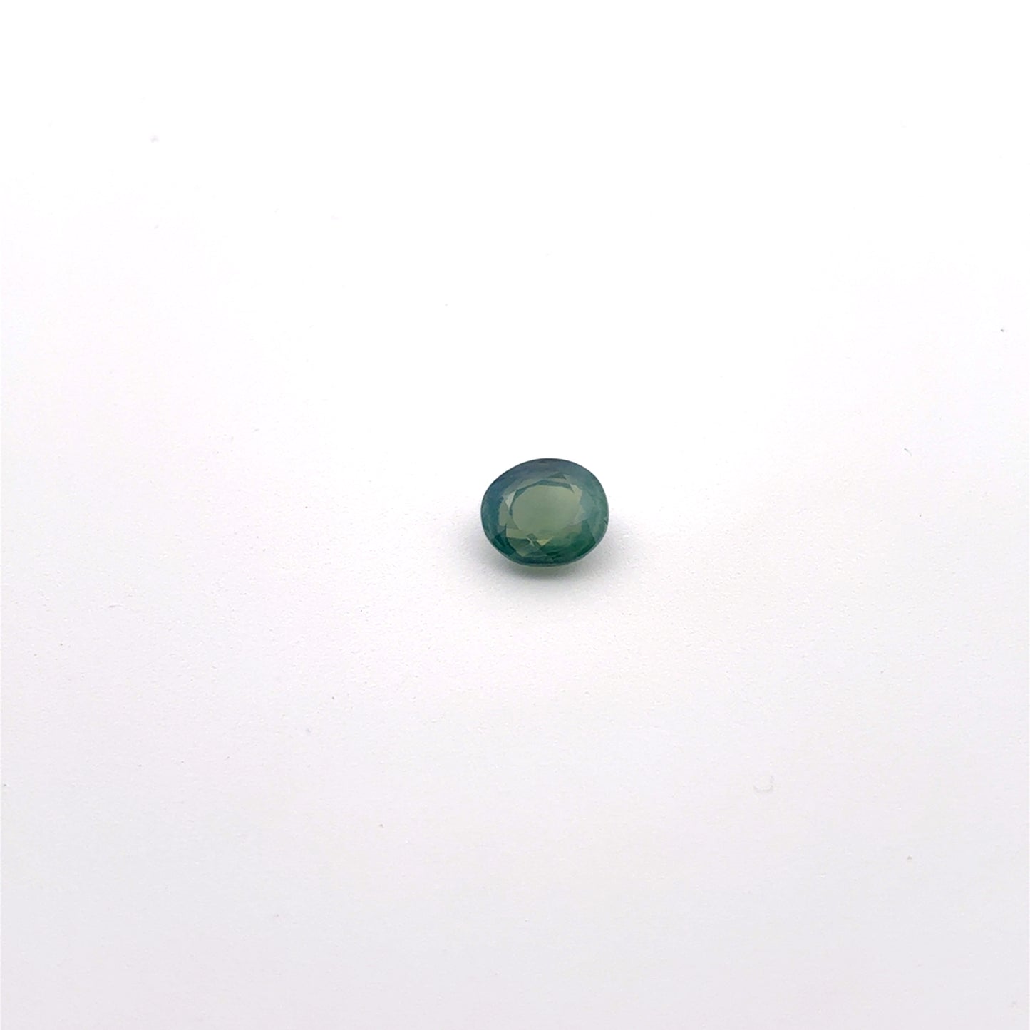 Natural Bluish Green Mermaid Sapphire 0.77 carat 5.5x4.8mm Oval Cut, Heated