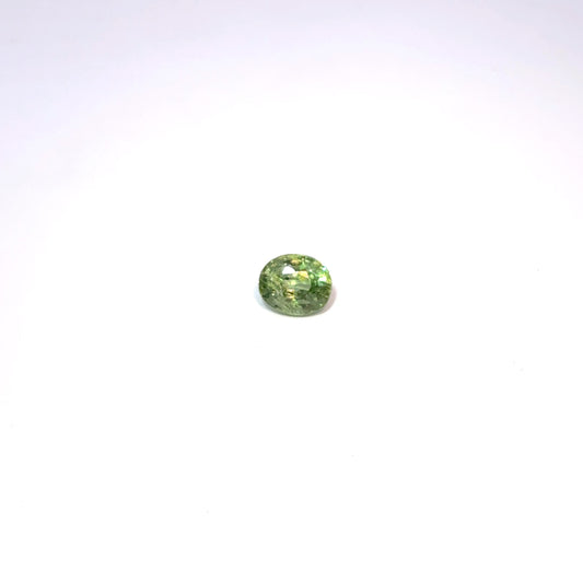 Green gemstone on a white background