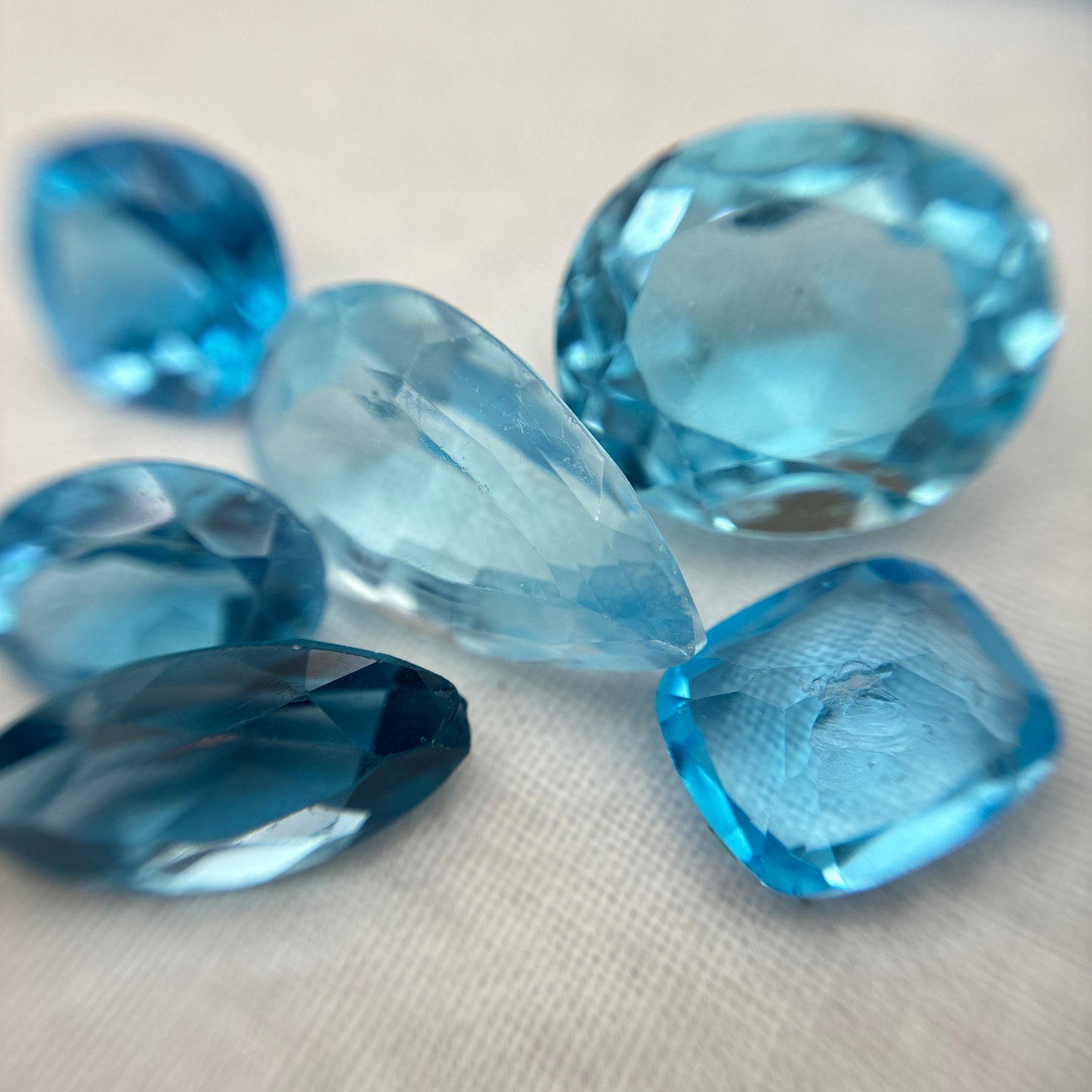 128 carat Lot of Damaged Blue Topaz-21 Piece Pre-formed Topaz Facet Rough