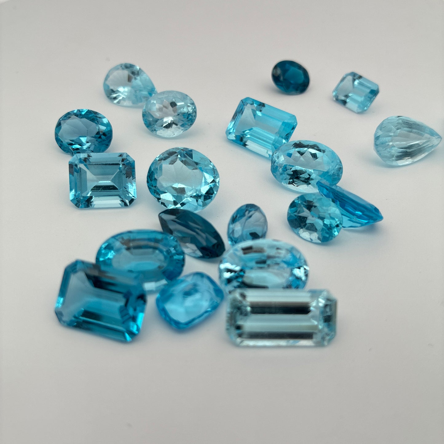 128 carat Lot of Damaged Blue Topaz-21 Piece Pre-formed Topaz Facet Rough