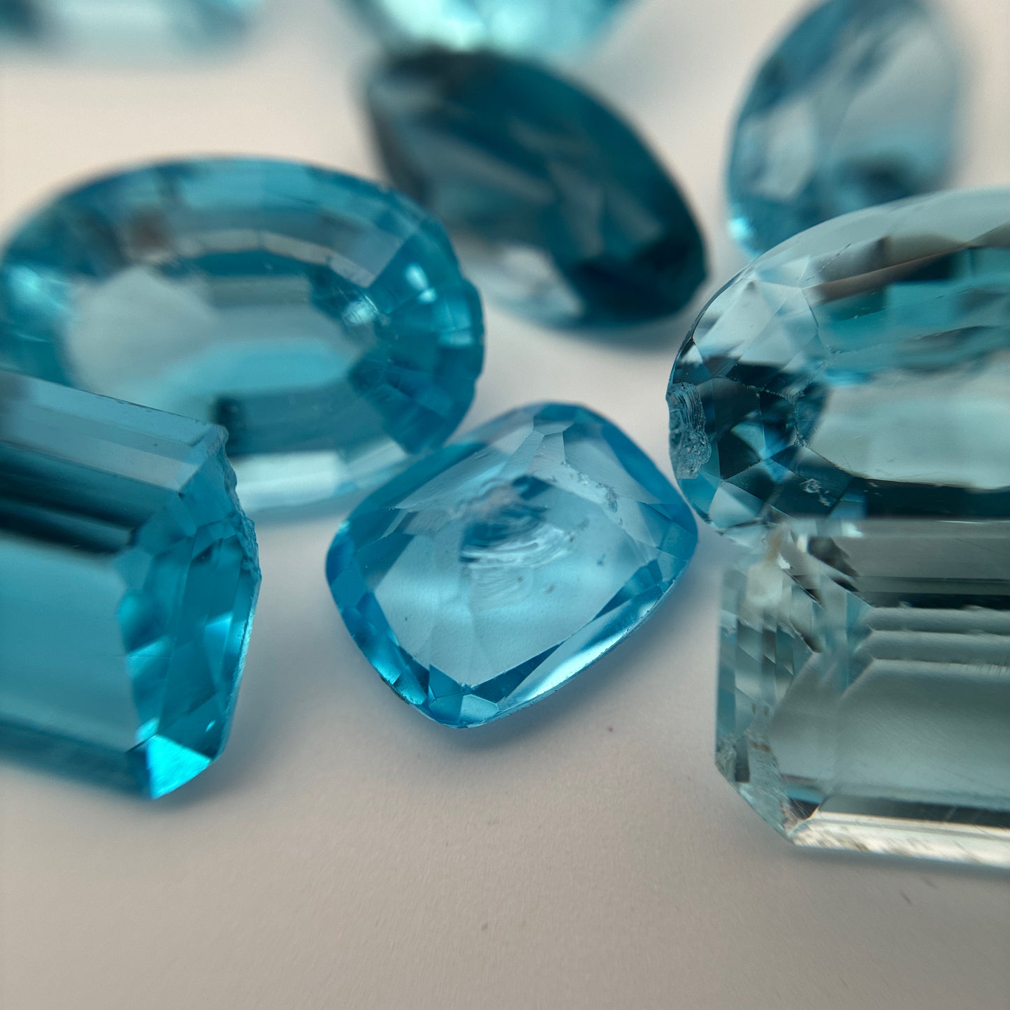 128 carat Lot of Damaged Blue Topaz-21 Piece Pre-formed Topaz Facet Rough