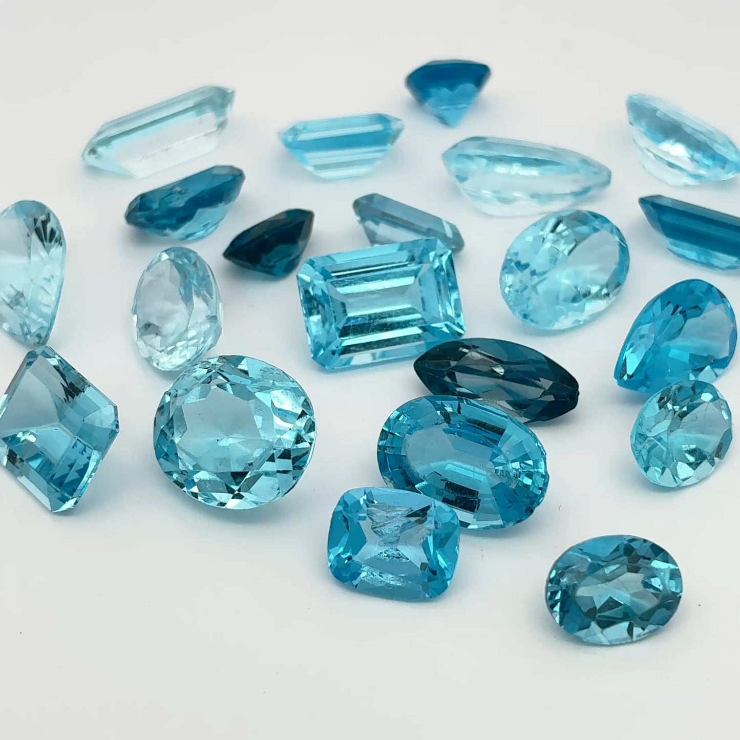 128 carat Lot of Damaged Blue Topaz-21 Piece Pre-formed Topaz Facet Rough