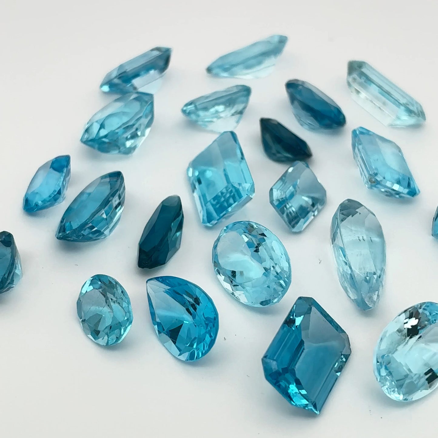 128 carat Lot of Damaged Blue Topaz-21 Piece Pre-formed Topaz Facet Rough