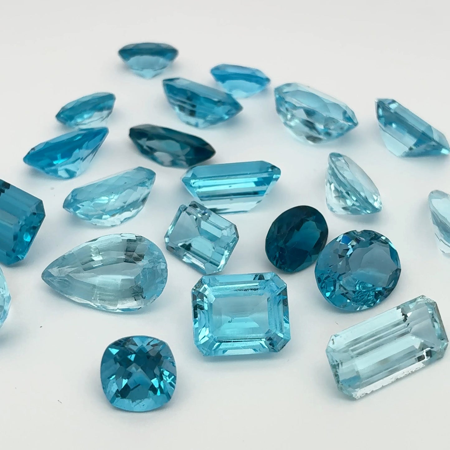 128 carat Lot of Damaged Blue Topaz-21 Piece Pre-formed Topaz Facet Rough