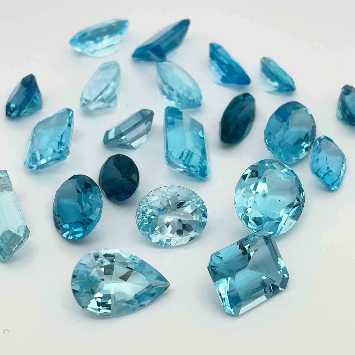 128 carat Lot of Damaged Blue Topaz-21 Piece Pre-formed Topaz Facet Rough