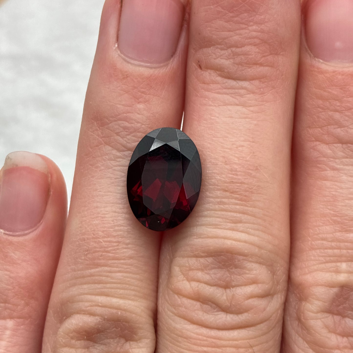 7.8 carat Purplish Red Garnet 14x10mm Oval Cut