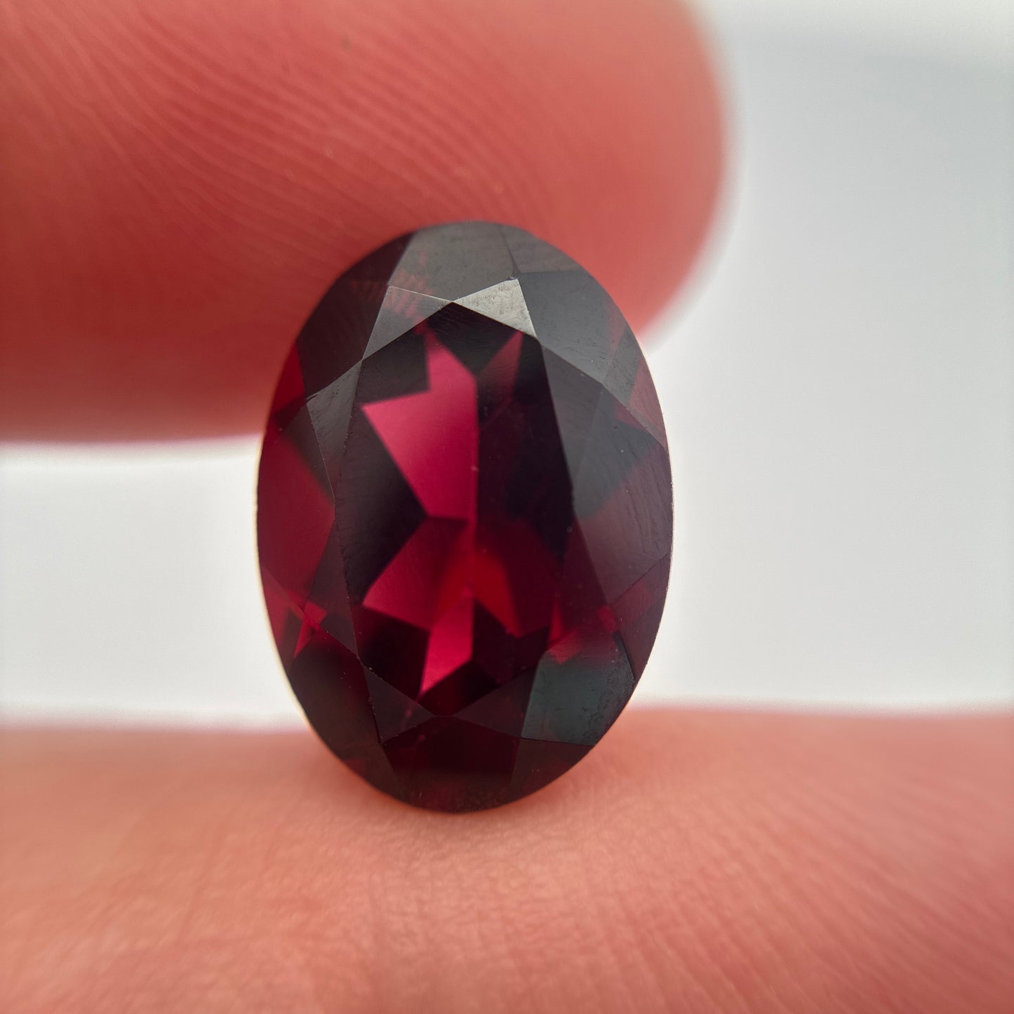 7.8 carat Purplish Red Garnet 14x10mm Oval Cut