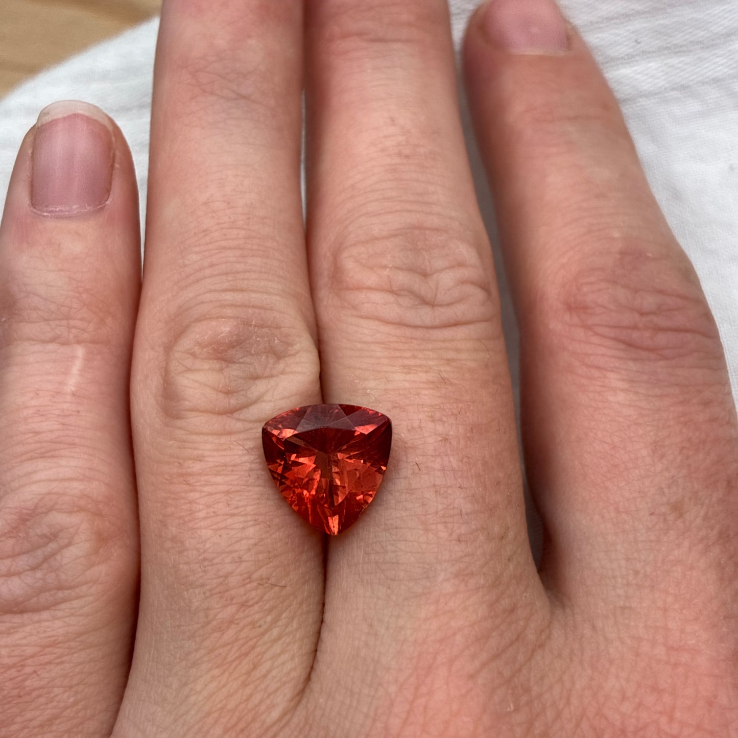 3.87 carat Orange Oregon Sunstone 10.75mm Trillion Cut